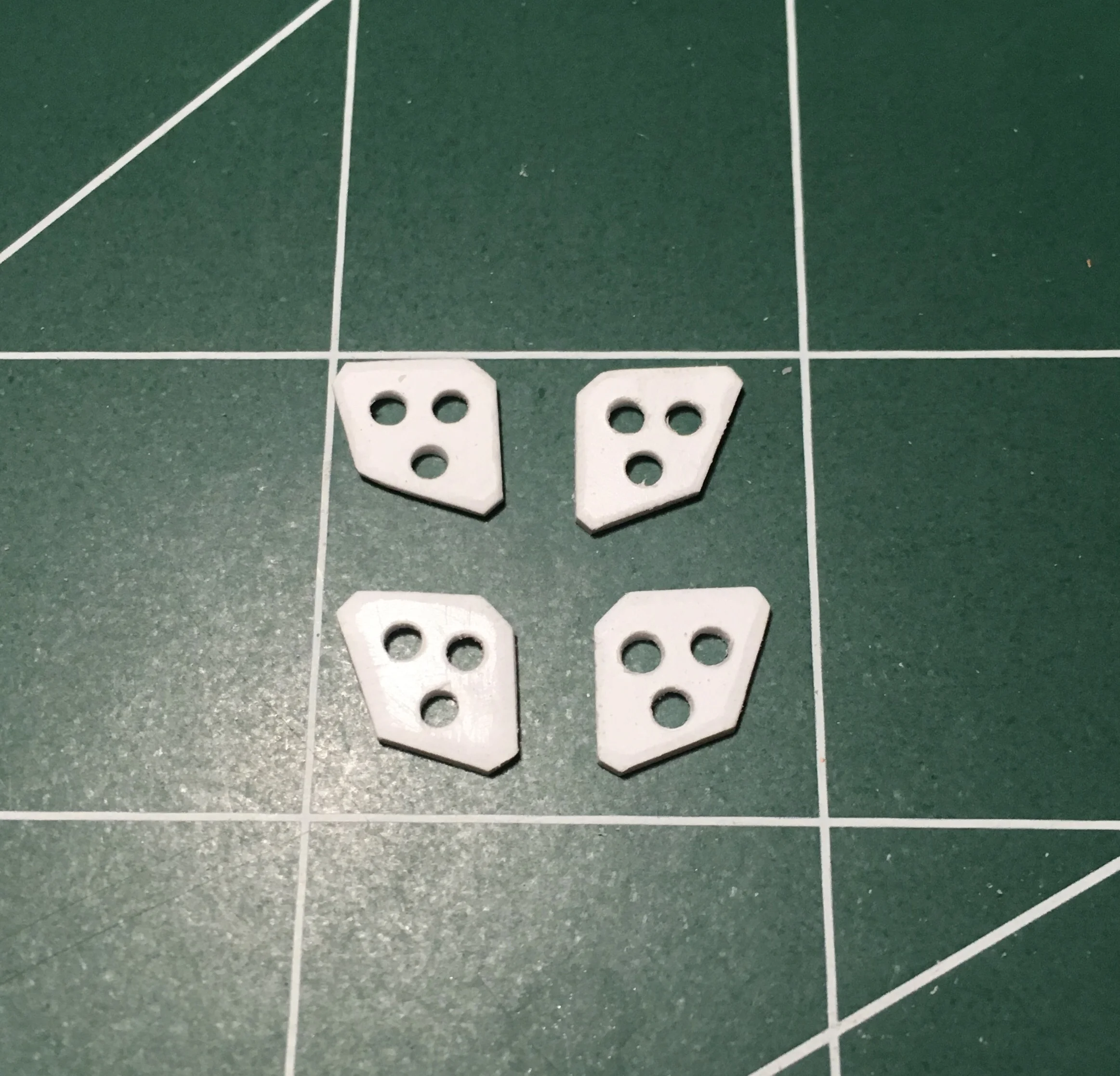 I drilled holes for detail, and filed the edges to give them a beveled edge look.