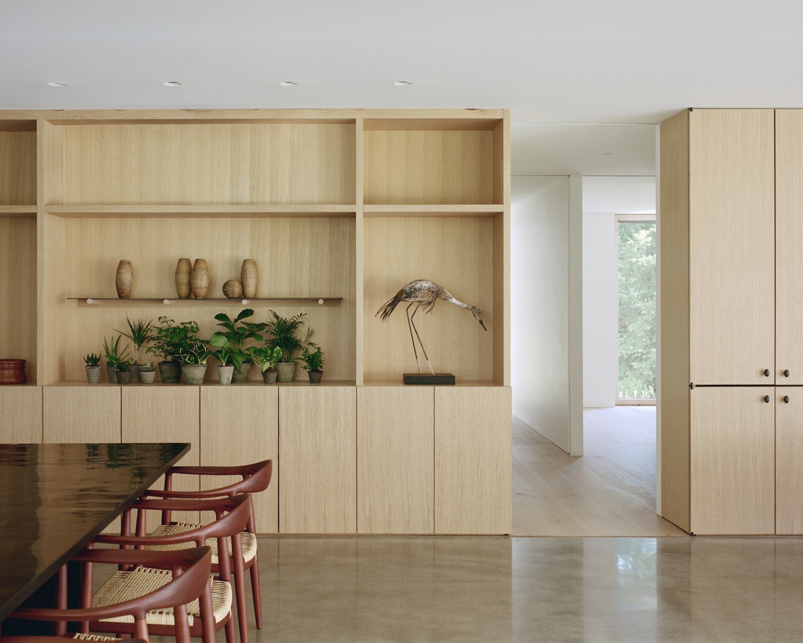 the-living-and-dining-rooms-have-custom-built-in-cabinetry-by-alula-woodworks.jpg
