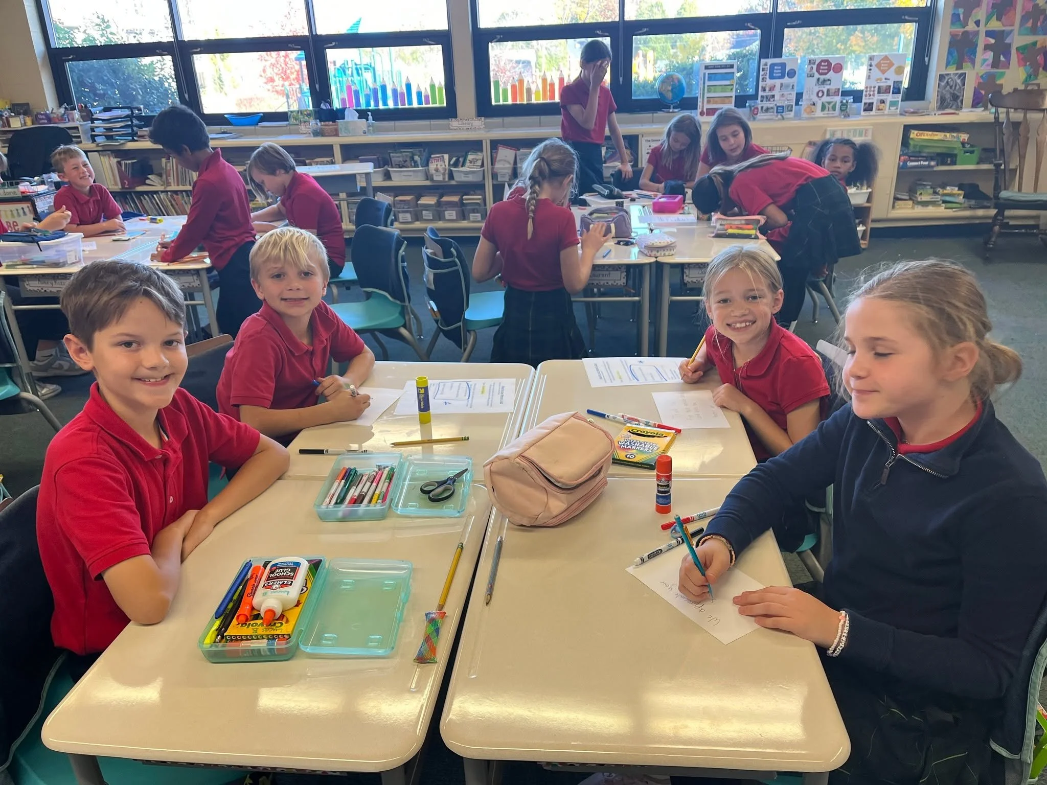 On this Veterans Day, we honor the men and women who serve in the military.  Our second and fifth grade guardian angels teamed up to make cards for friends and relatives of our school community who have served.  We hope that today they check their ma