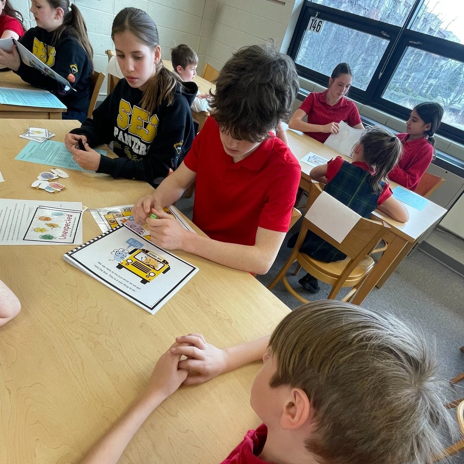 We had a special guidance session today for all student bus riders.  Older students read a story about bus safety and etiquette, and then led small groups in a bus safety game.  It is important to remind our students how to behave safely and politely