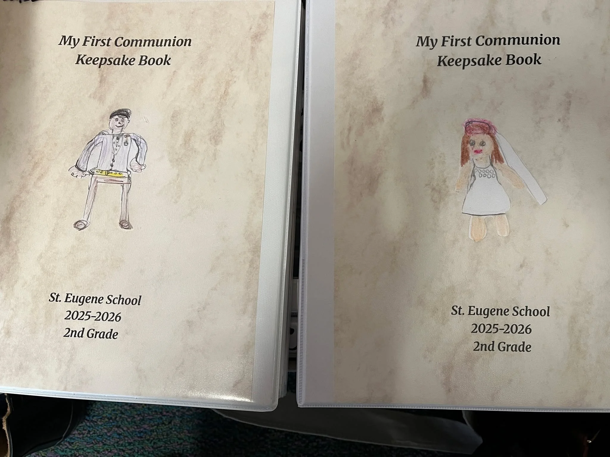 First Communion keepsake books are a beautiful tradition in Mrs. Luna's second grade class.  This week, this year's second grade received theirs as they prepare to receive their First Eucharist this weekend.  The books are filled with treasures and l