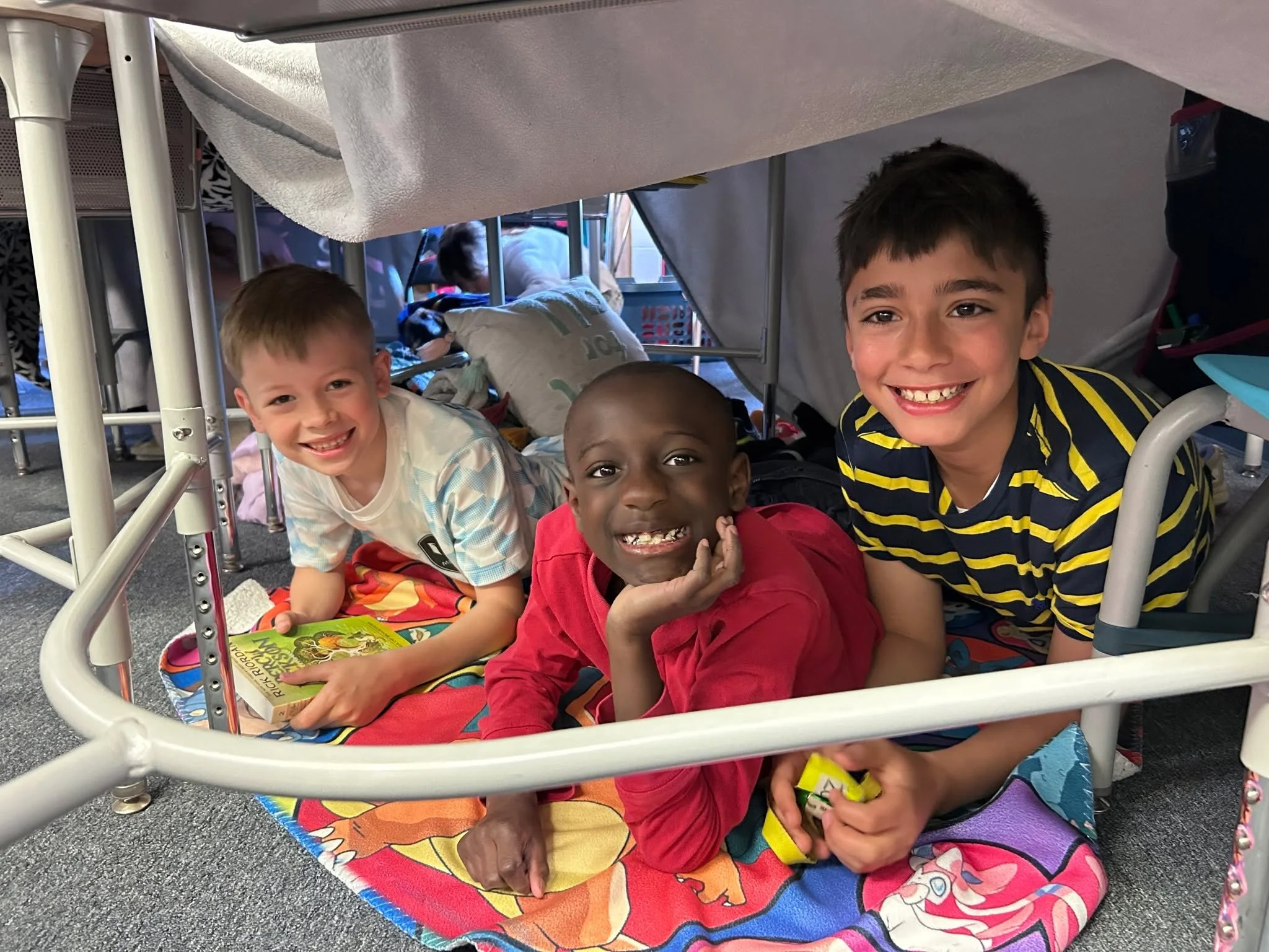 Third graders winding down after a busy week with books in blanket forts under their desks. What a great way to head into the weekend!! 📚