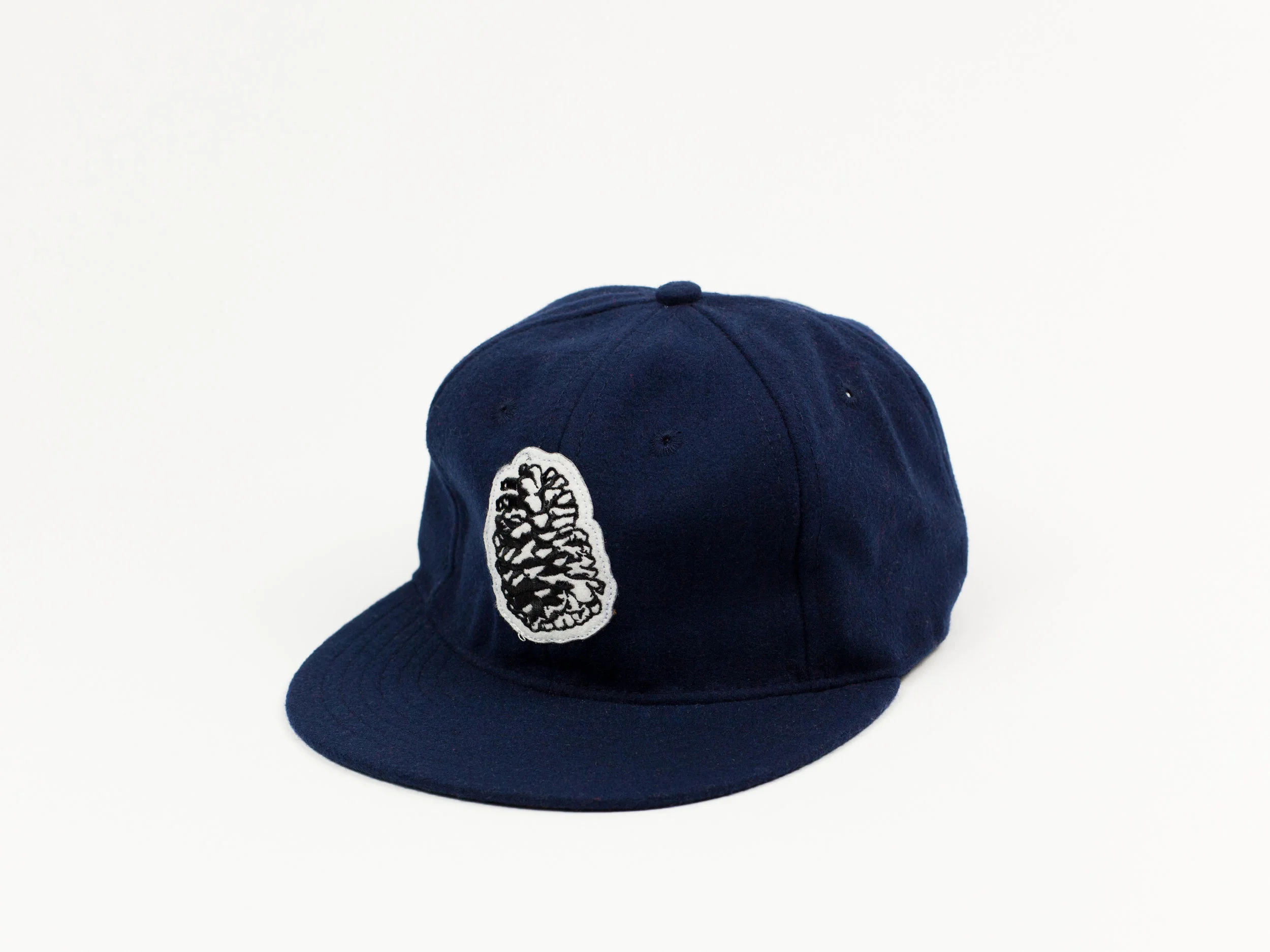 Blk_Pine_Ballcap_Pinecone_Navy_angle.jpg