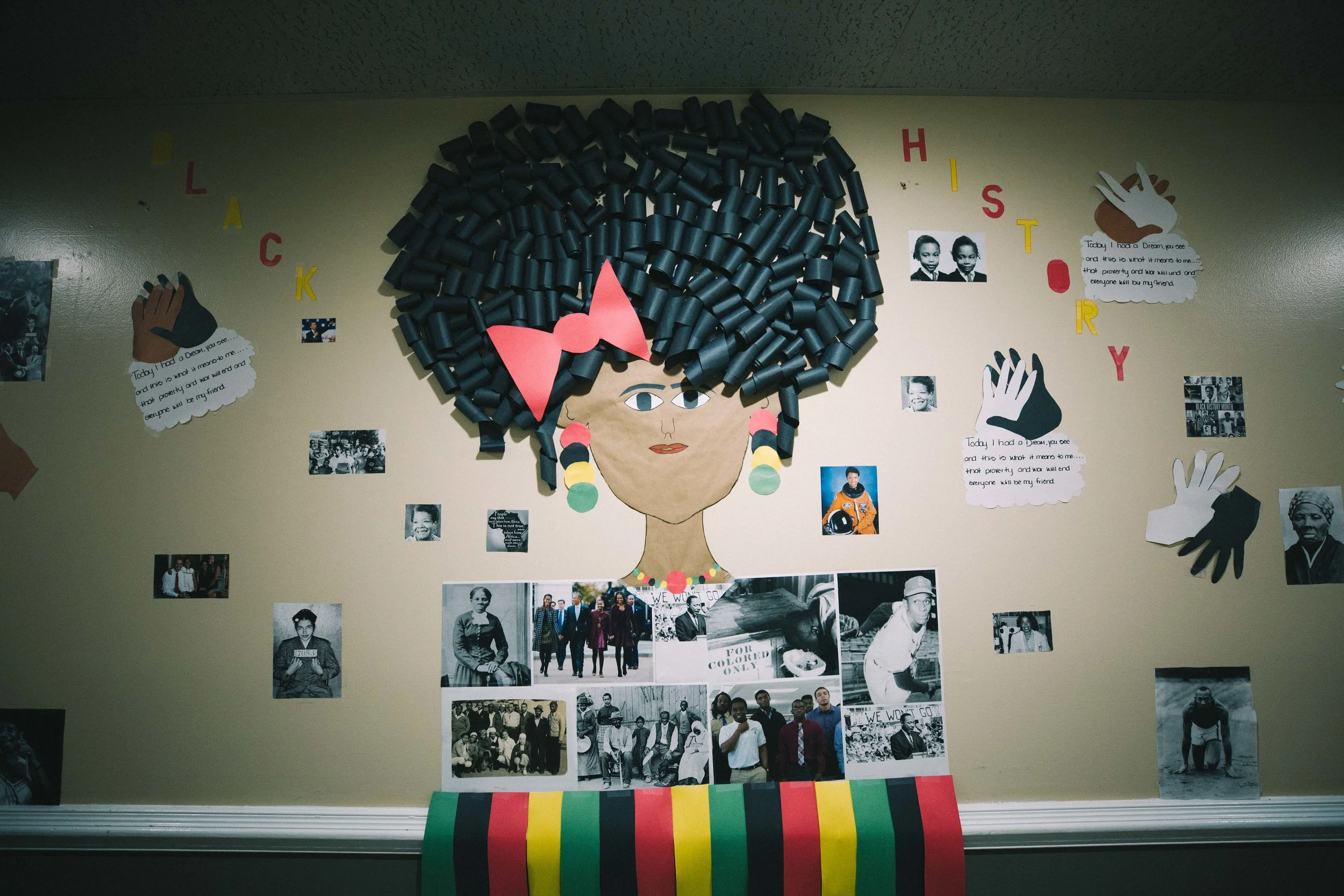 Good Neighbor Day Support team members and individuals create a mural celebrating Black History Month.