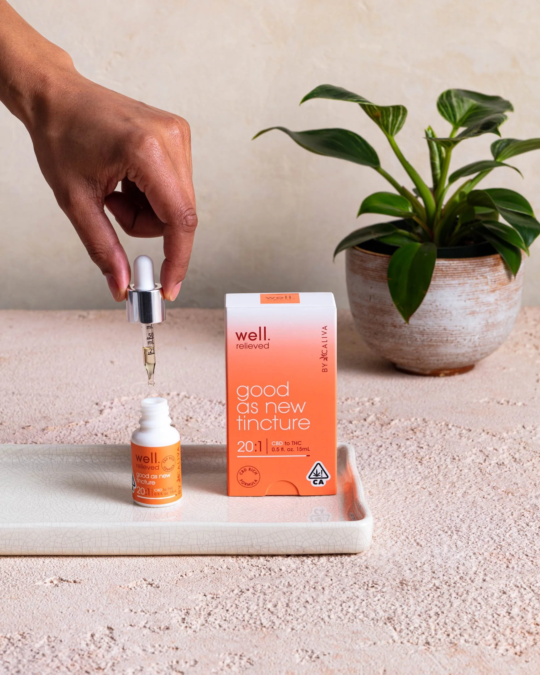 erinscott-cannabis-photographer-product-organic-natural-well-caliva-womanholdingtincturedropper.jpg