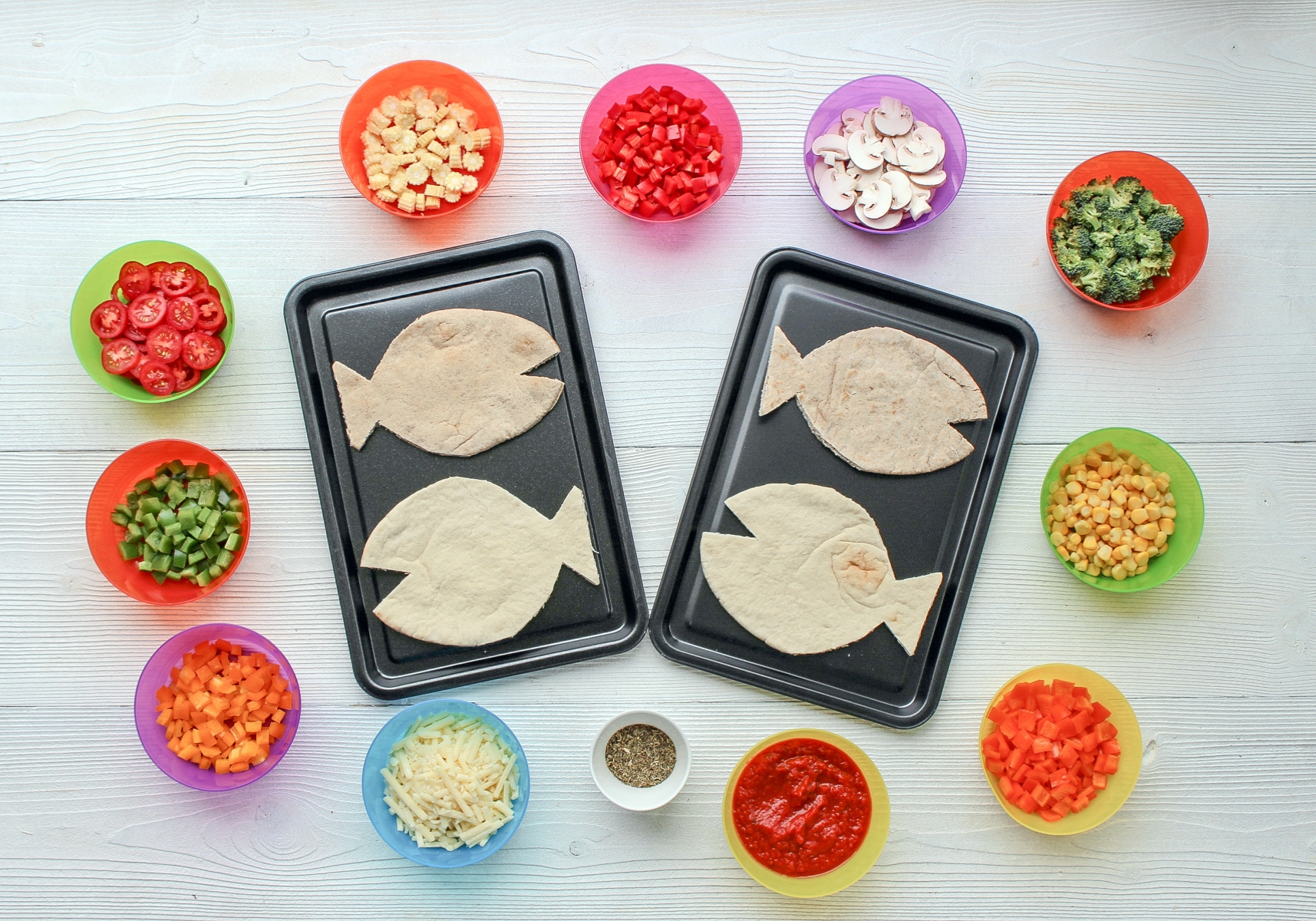 Carefully trim pitta into fish shapes