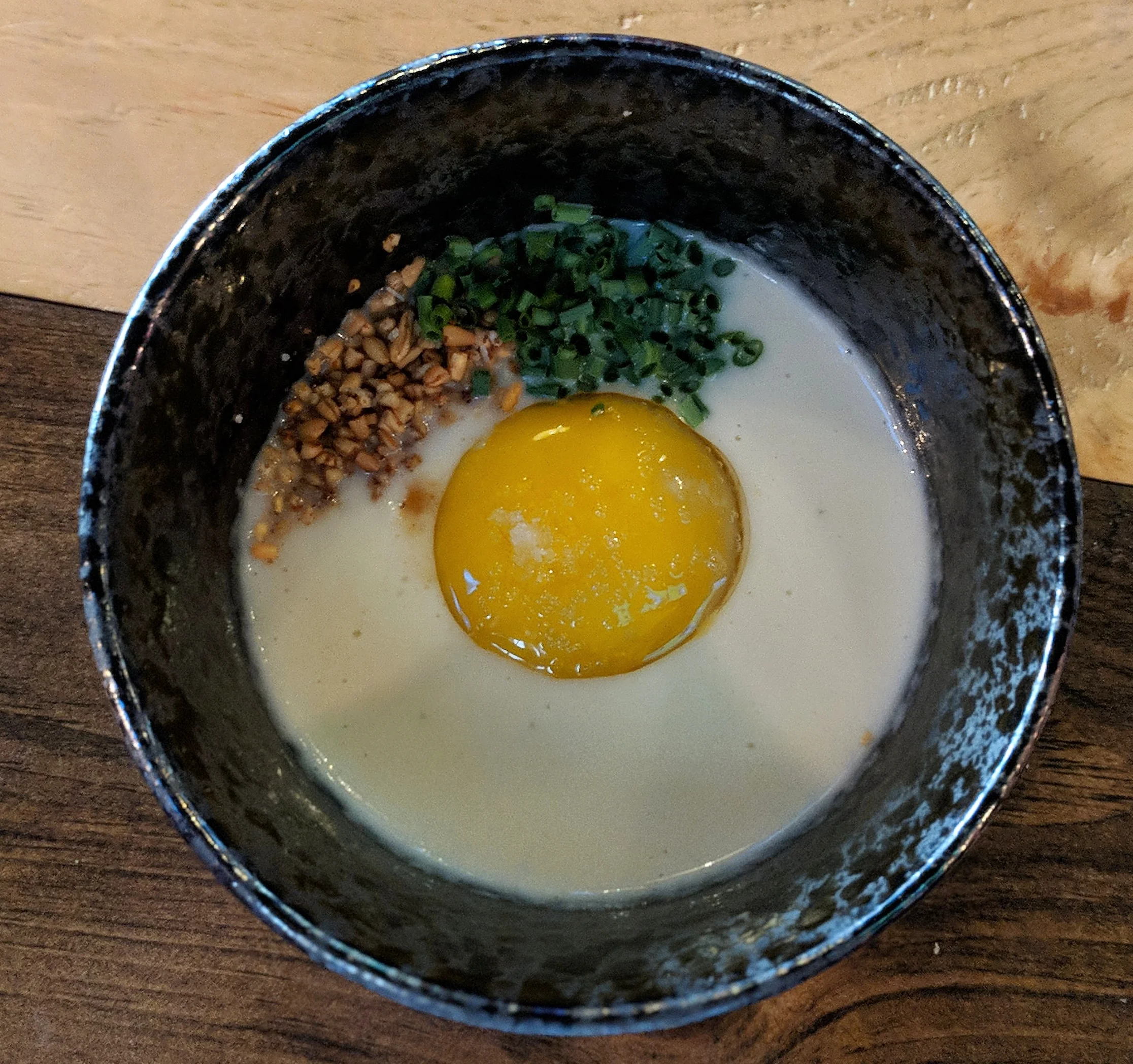 First Course: Confit egg yolk sweet onion soubise with apple jam brown butter oats and snipped chives. Not pictured: Cabernat Sauvignon with infused honey dew