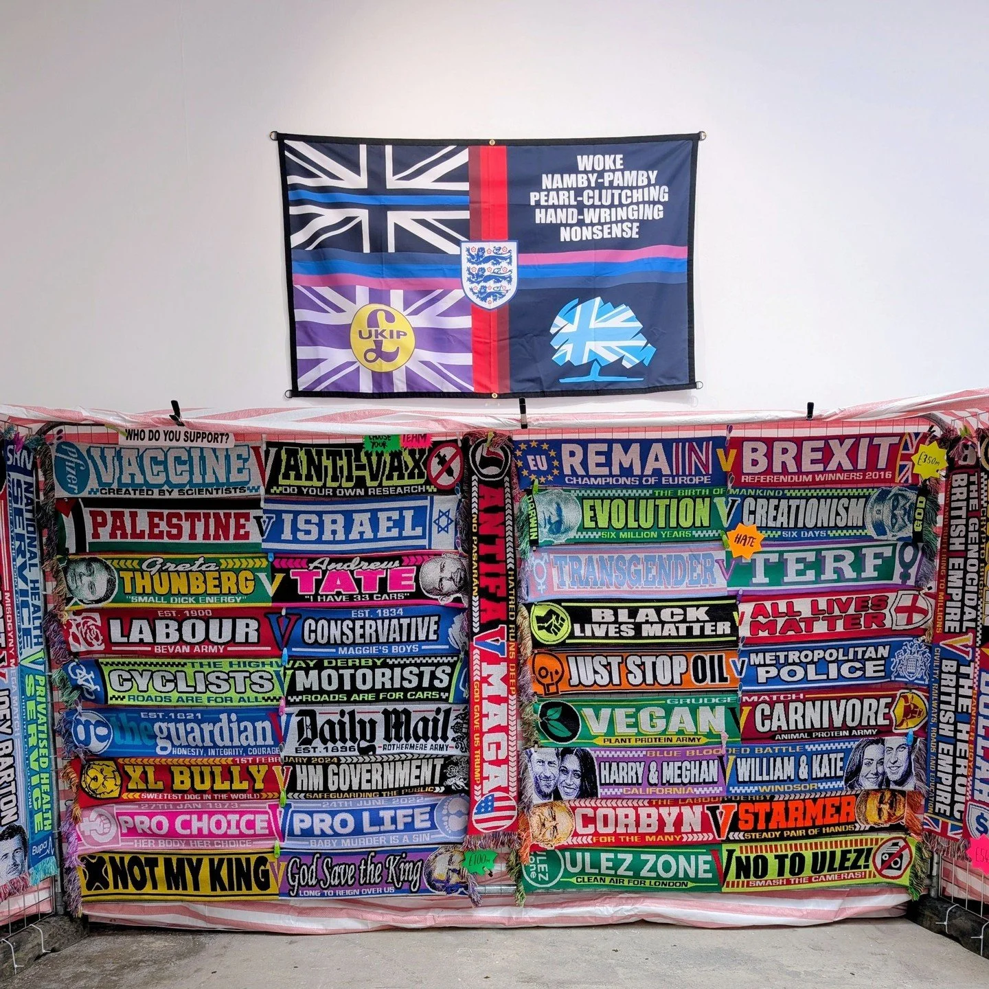 The consistently excellent Cass Art Prize (exhibition now closed) had a controversial winner, an artist who goes by the artist name &lsquo;World of W*nkers&rsquo; (my censoring). It's a fun stall of football scarves showing opposing persons and views