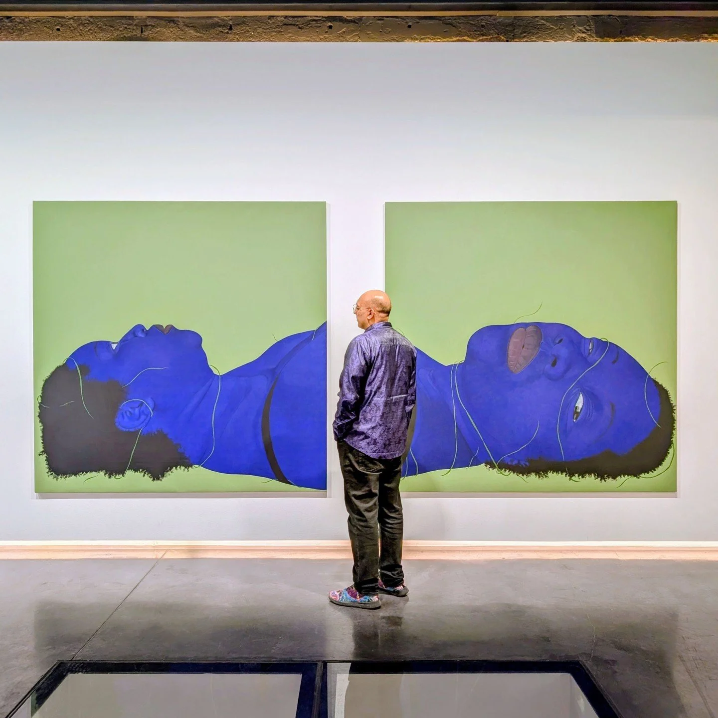 These are striking figurative paintings, and up close, you can see the subtle embroidery. She paints in Indigo due to its links to the suppression of the black body through forced labour and exploitation. They are powerful, memorable paintings. 

One