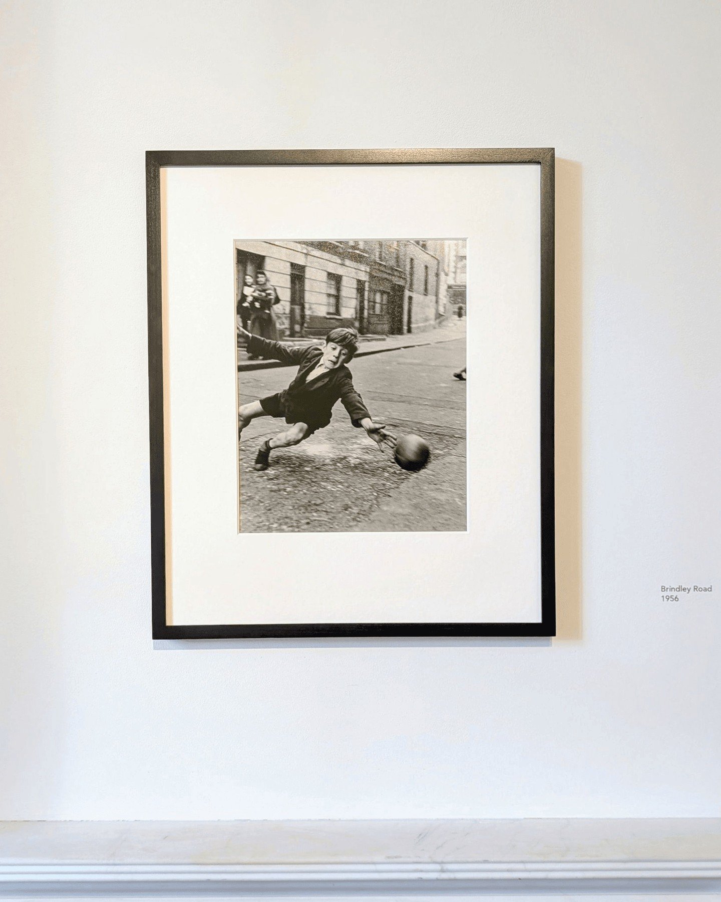 Playing football in the street is a tradition many British children grew up with, jumpers for goalposts, and anywhere could become a pitch. Roger Mayne captured the poverty and hardship of inner-city life in West London in the late 1950s, but these p
