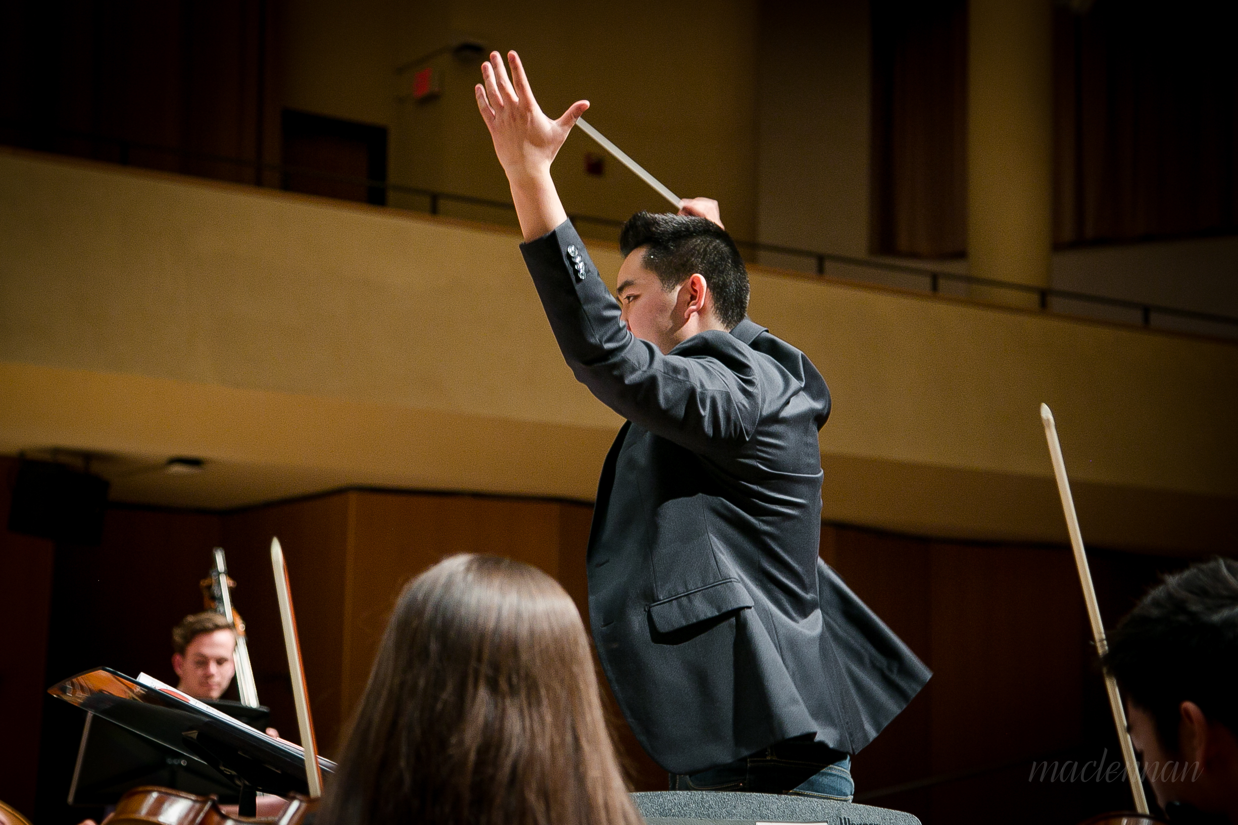 Hunter Chang conducting the rehearsal for the premiere of his Violin Concerto in Pick Staiger Concert Hall