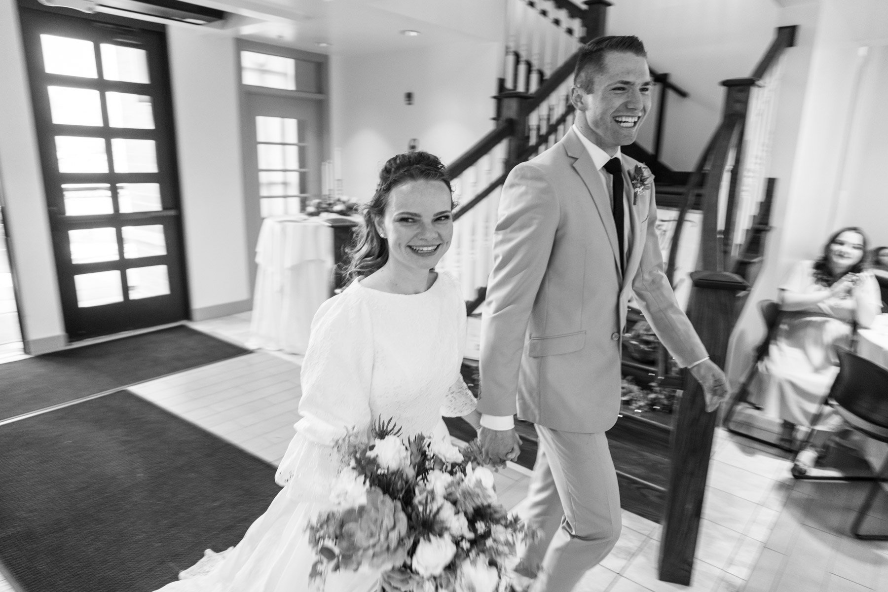 bride and groom enter the party