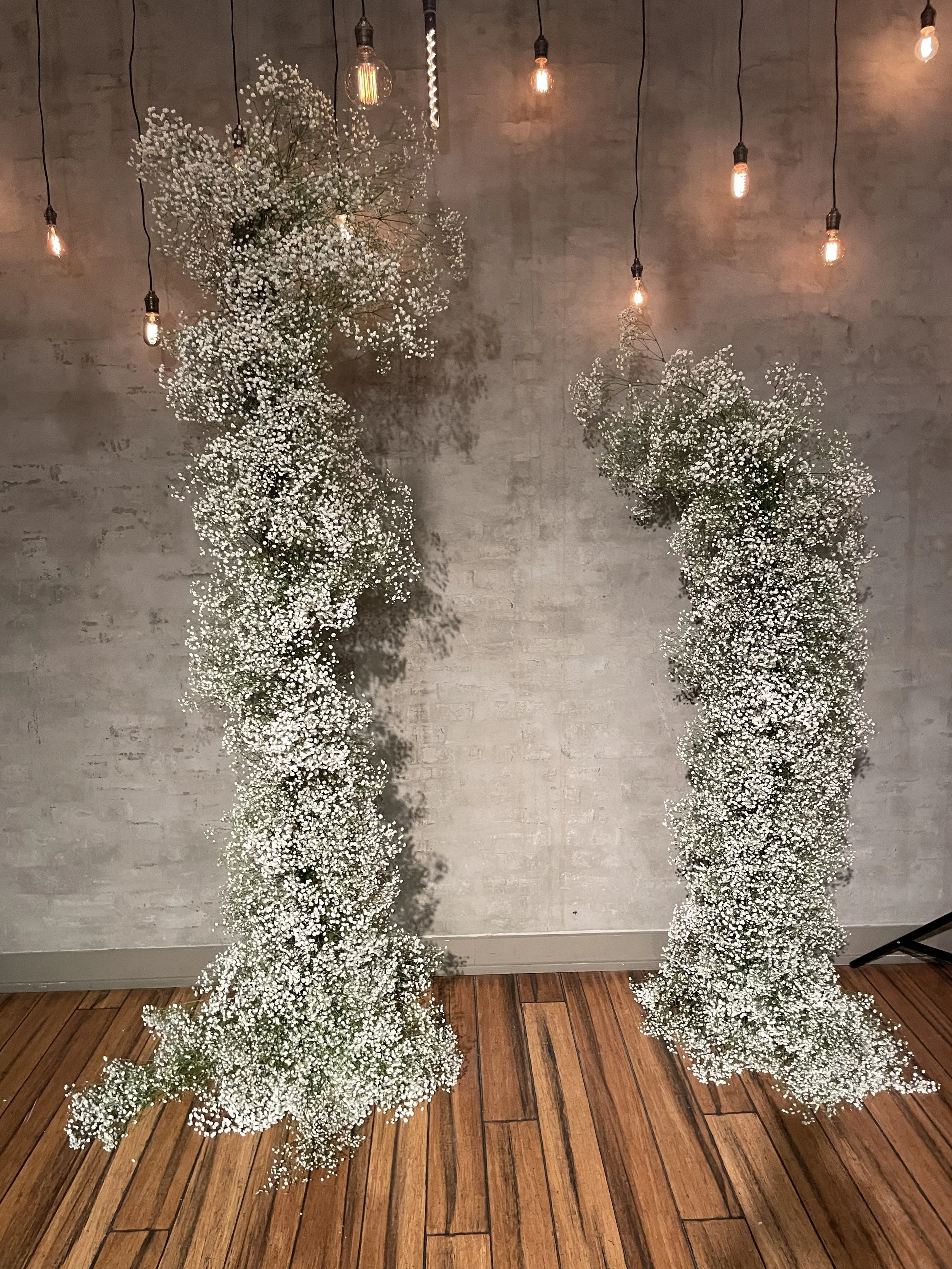 Baby's Breath Asymmetrical arch by Flower Clvb.jpeg