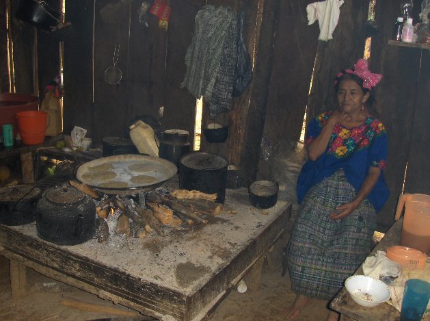  The villagers traditionally cook on open "three stone" fires. They use these fires to boil water, cook, and heat their huts. 