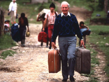 Dr. Leeon Aller, founder of HFPF, carrying suitcases of medicine for a stay in Barillas.