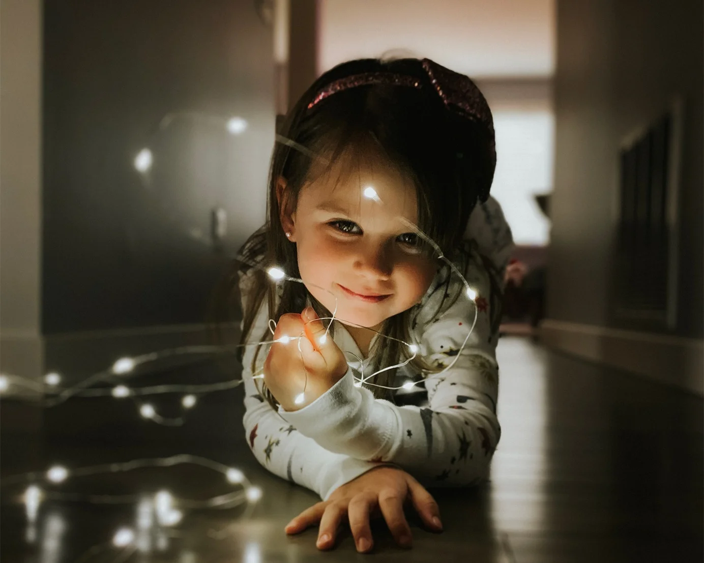 Shot-on-iPhone-holiday-Little-girl-with-string-lights-12192018_big.jpg.medium_2x.jpg