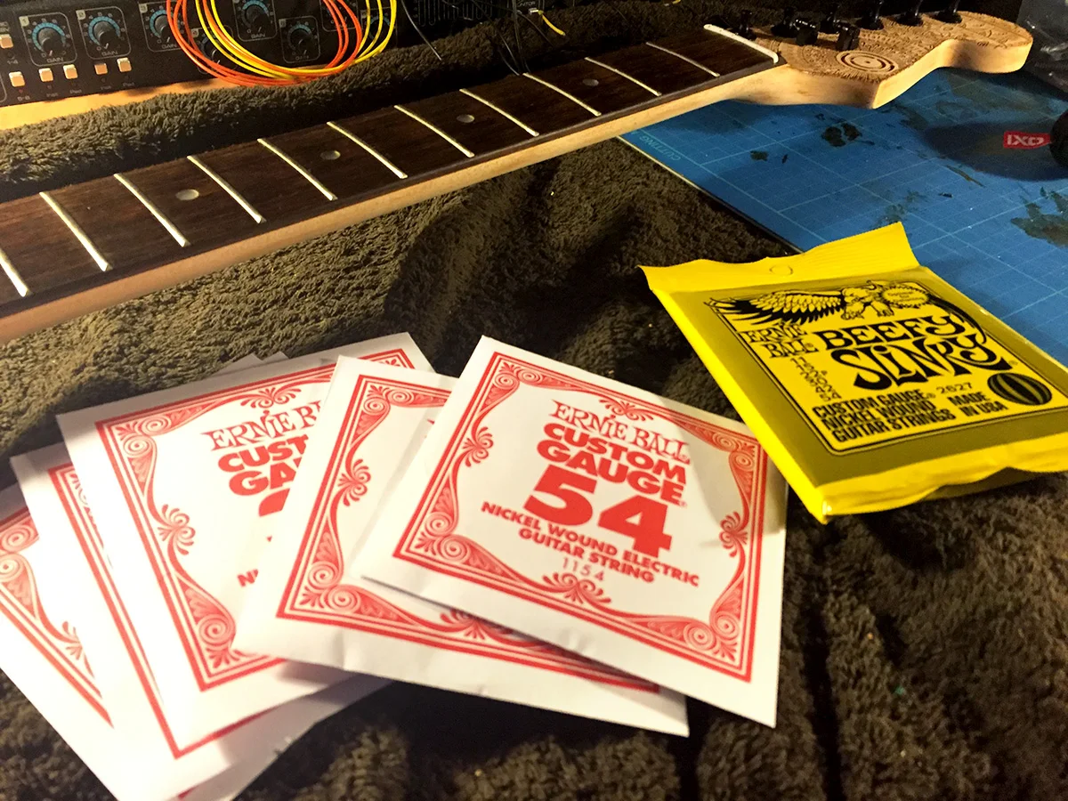 ernie ball custom guage 54 fitted to burntaxe one bespoke and handmade to order in brighton england
