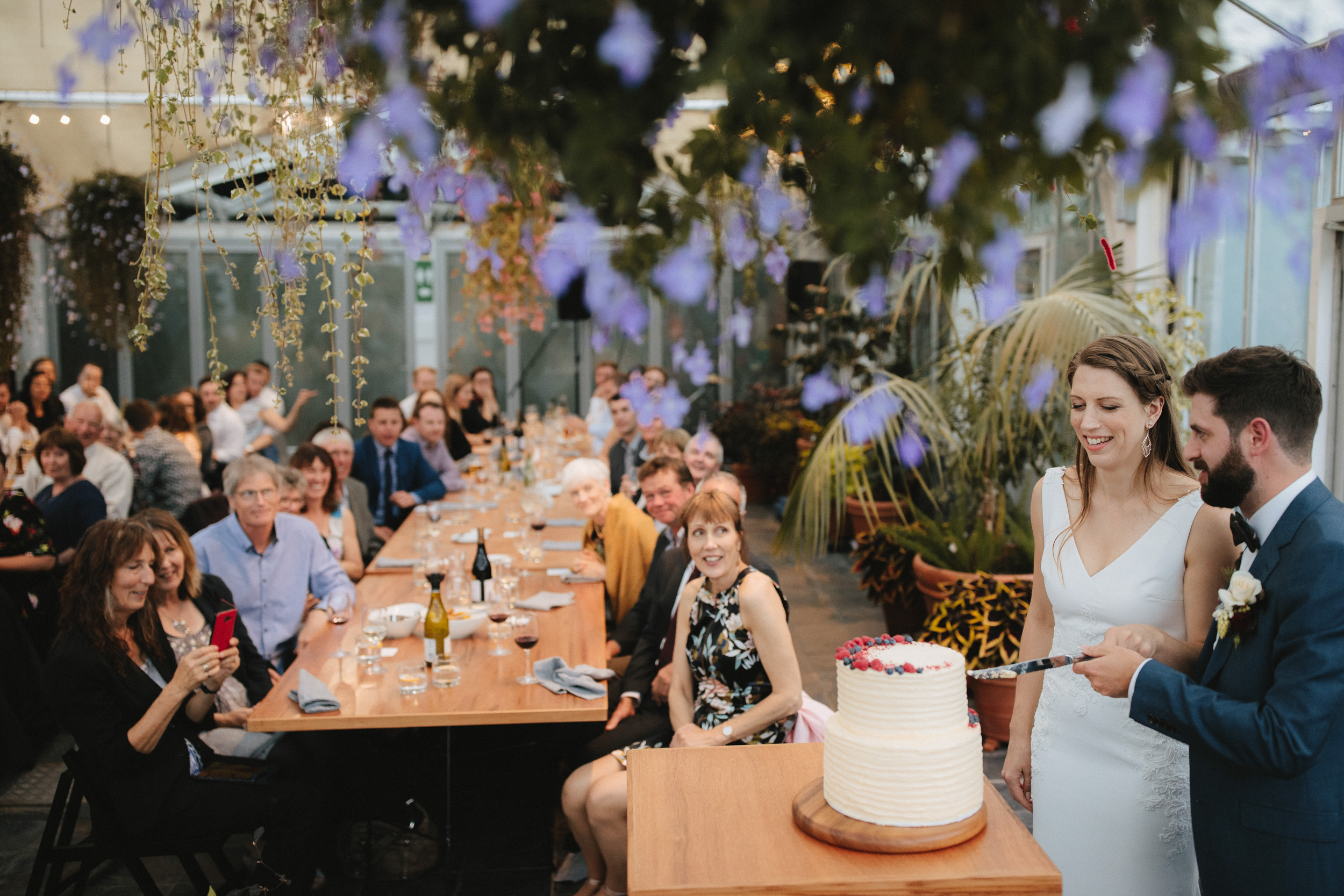 Couple cut their cake at their Botanic Garden wedding