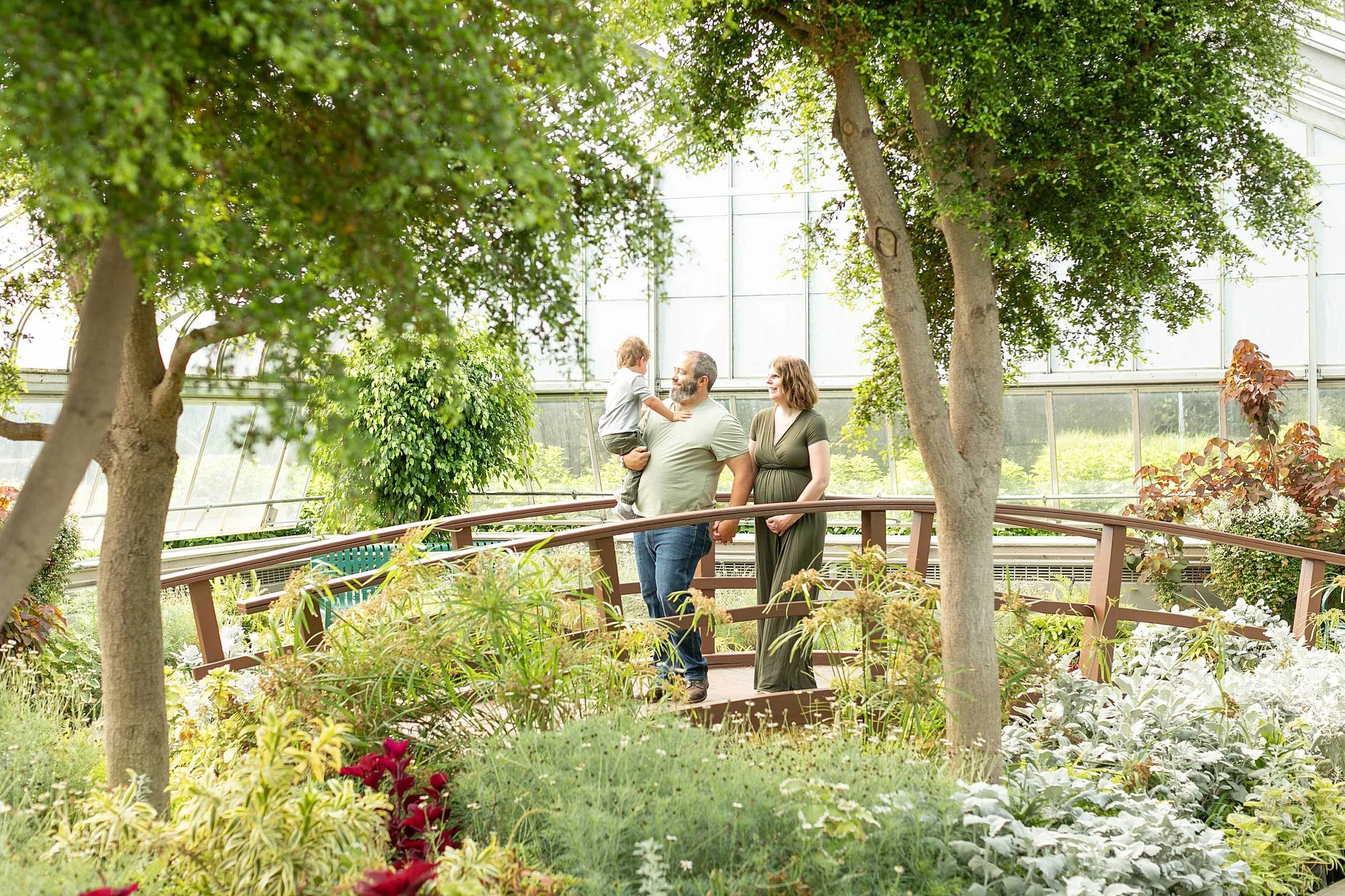 Bird haven greenhouse maternity family photos at pilcher park in joliet illinois