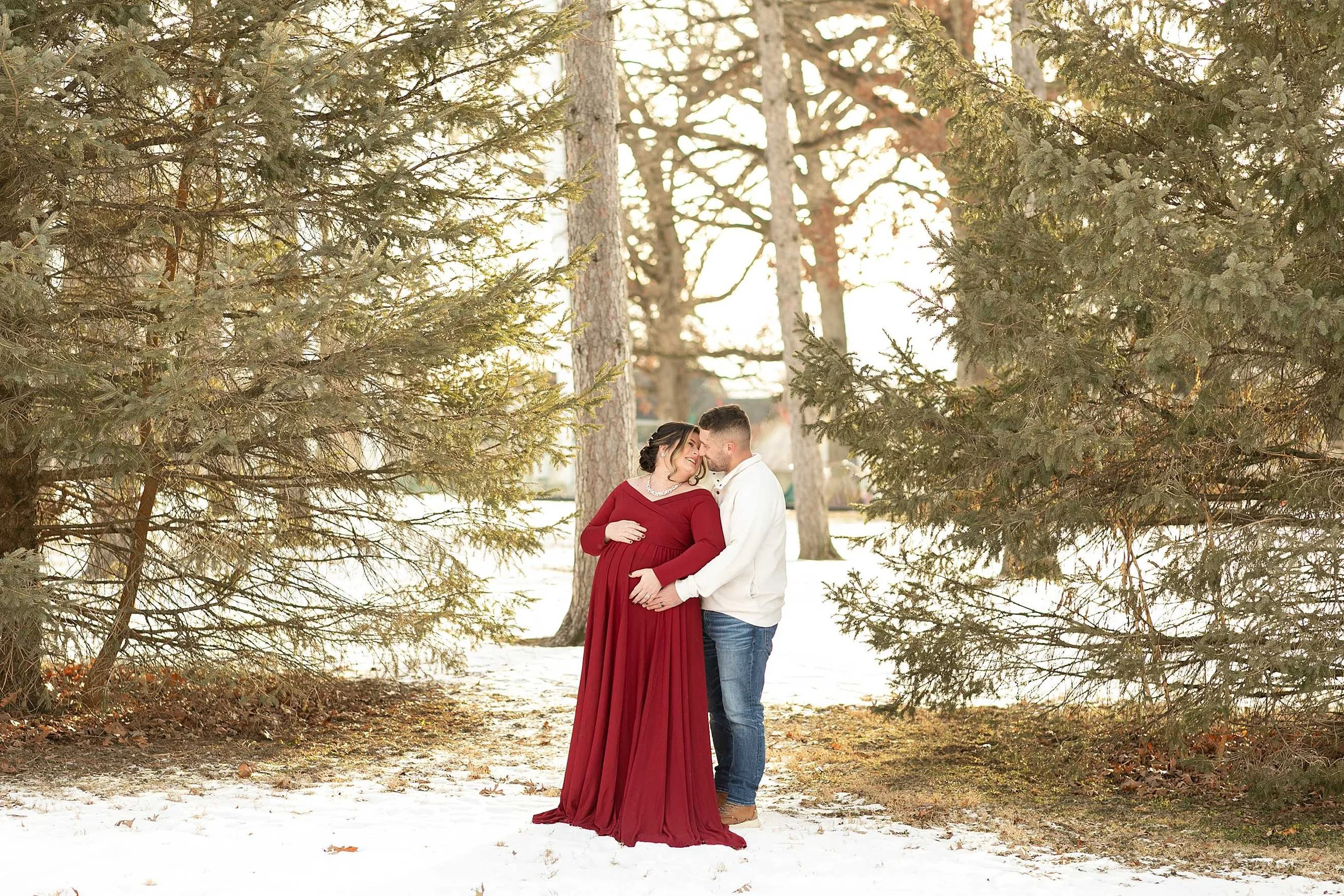 Snowy winter maternity session at evergreen park in Lowell Indiana