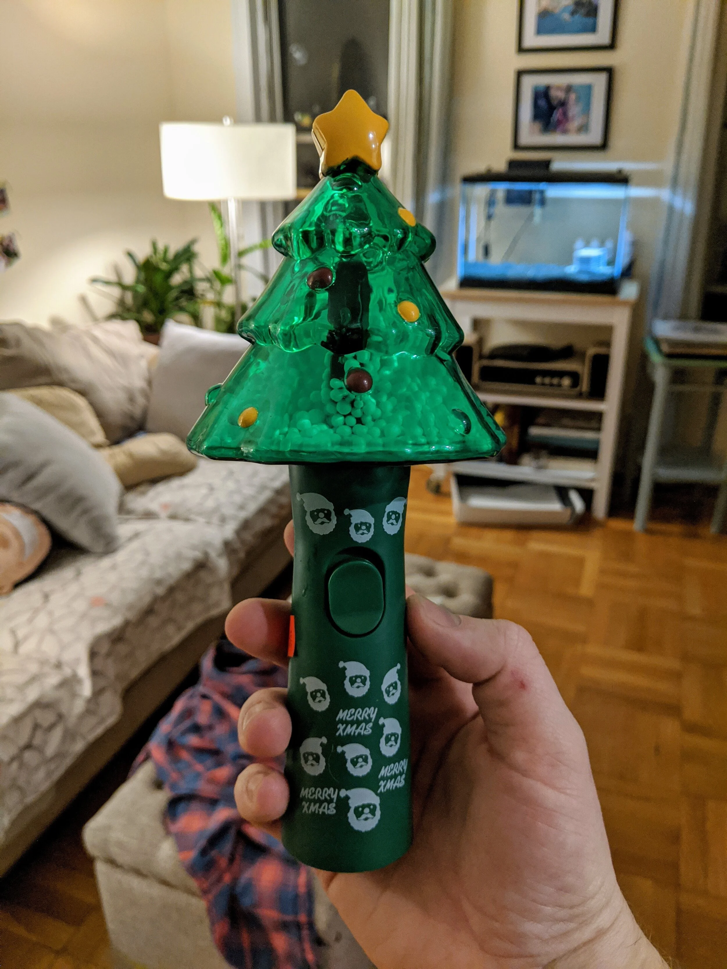 A simple Christmas toy that spins small Styrofoam balls inside of an enclosure