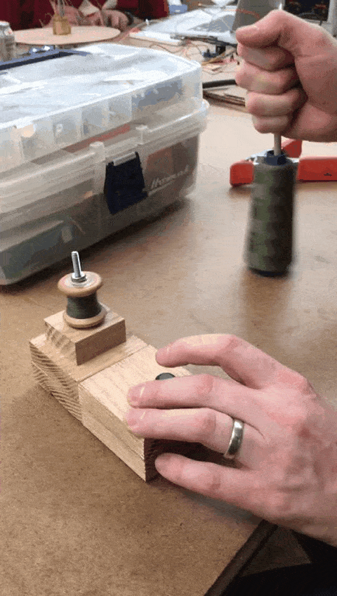 The spooling machine spooling some thread