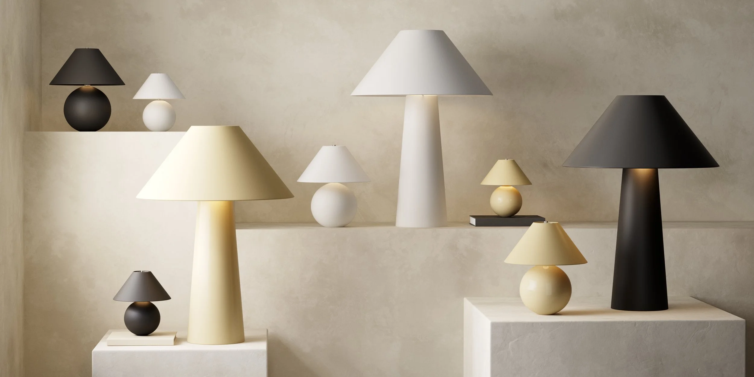 Display of various modern table lamps and decorative spheres in black, white, and beige, arranged on neutral-colored platforms and backgrounds.