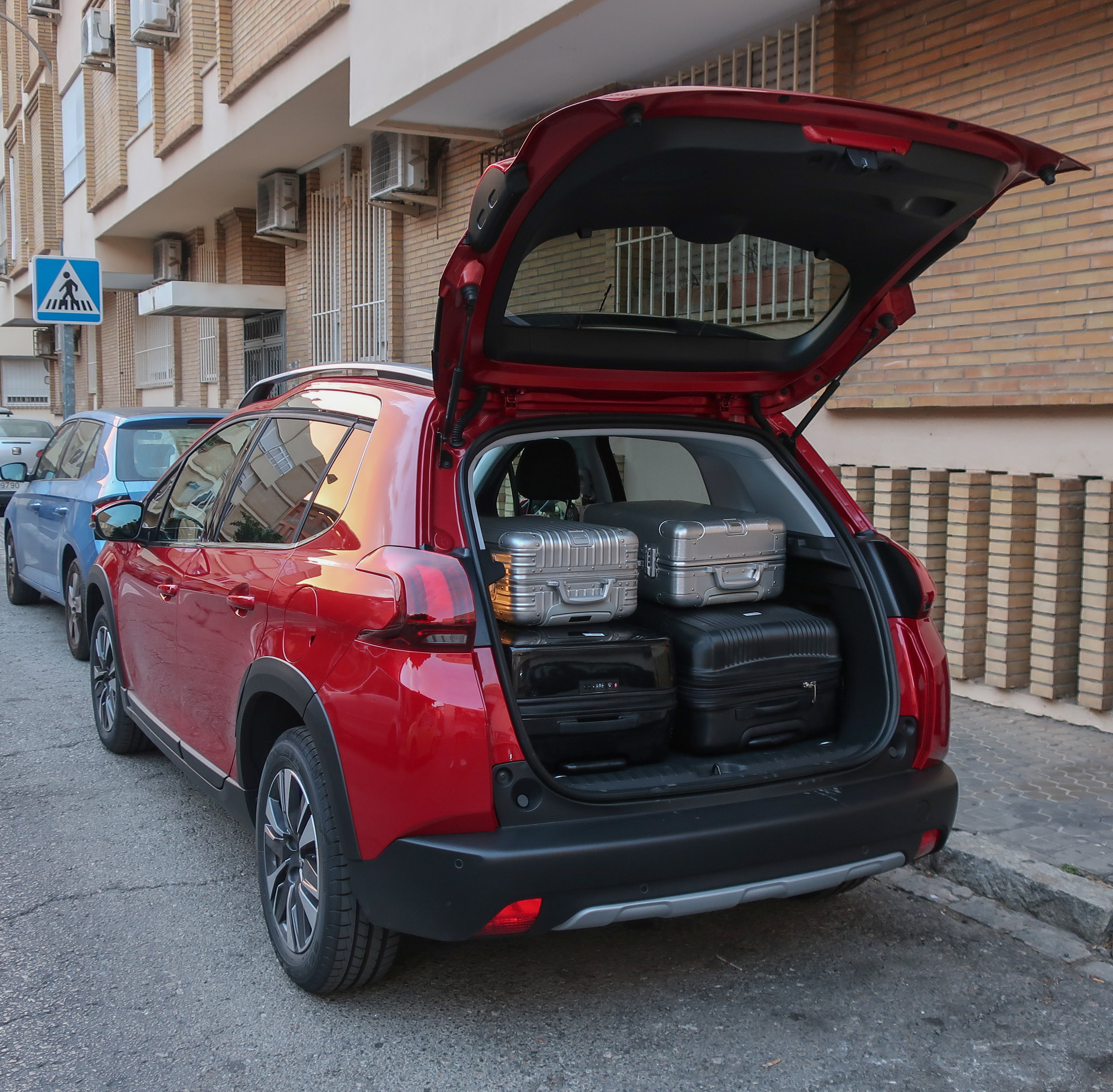  Packed the Peugeot 2008 with two large suitcases and two small suitcases. We folded the backseats down to make more room for our backpacks, photography gear, and extras. 