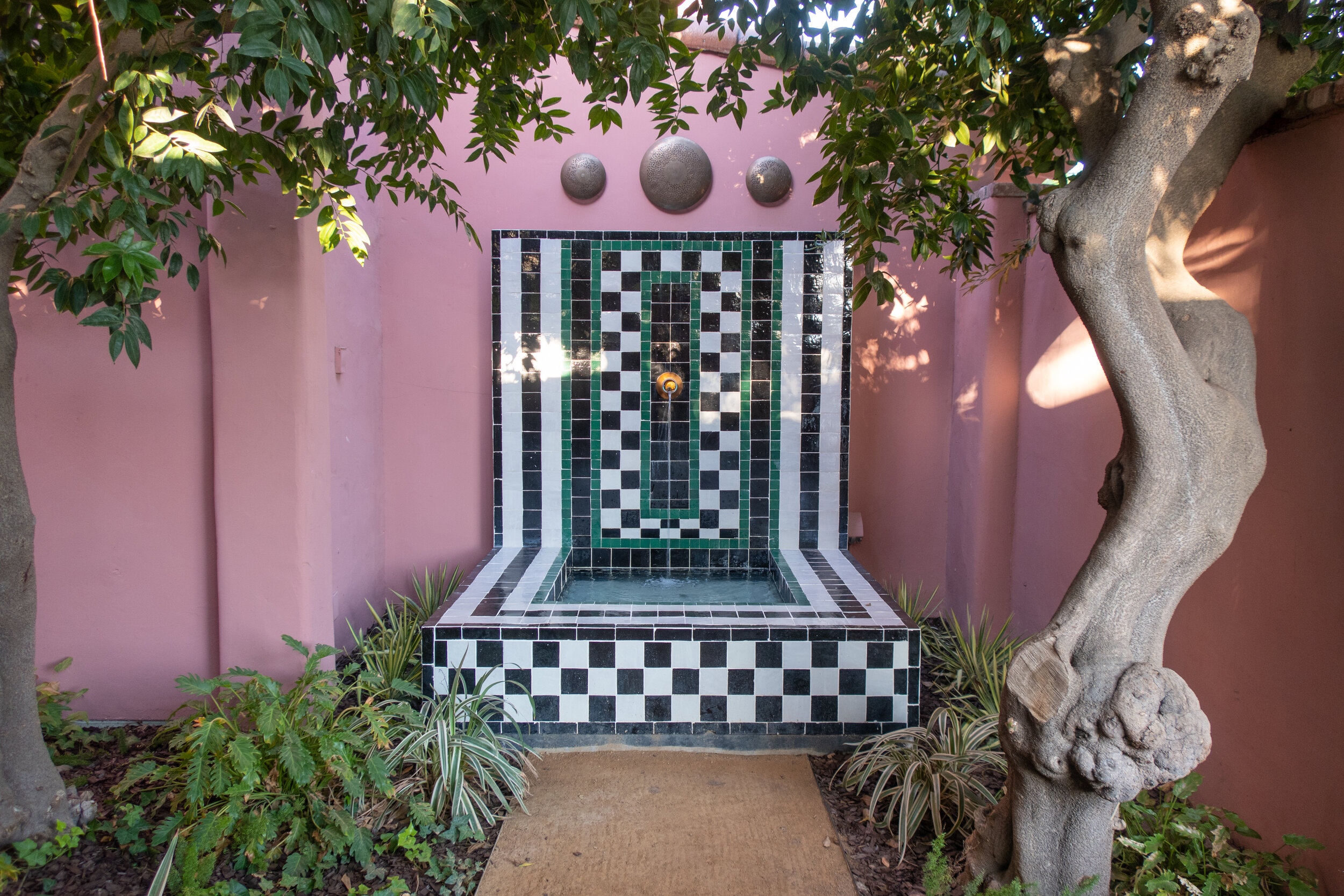   A Moroccan tiled fountain at the entrance of the hotel  