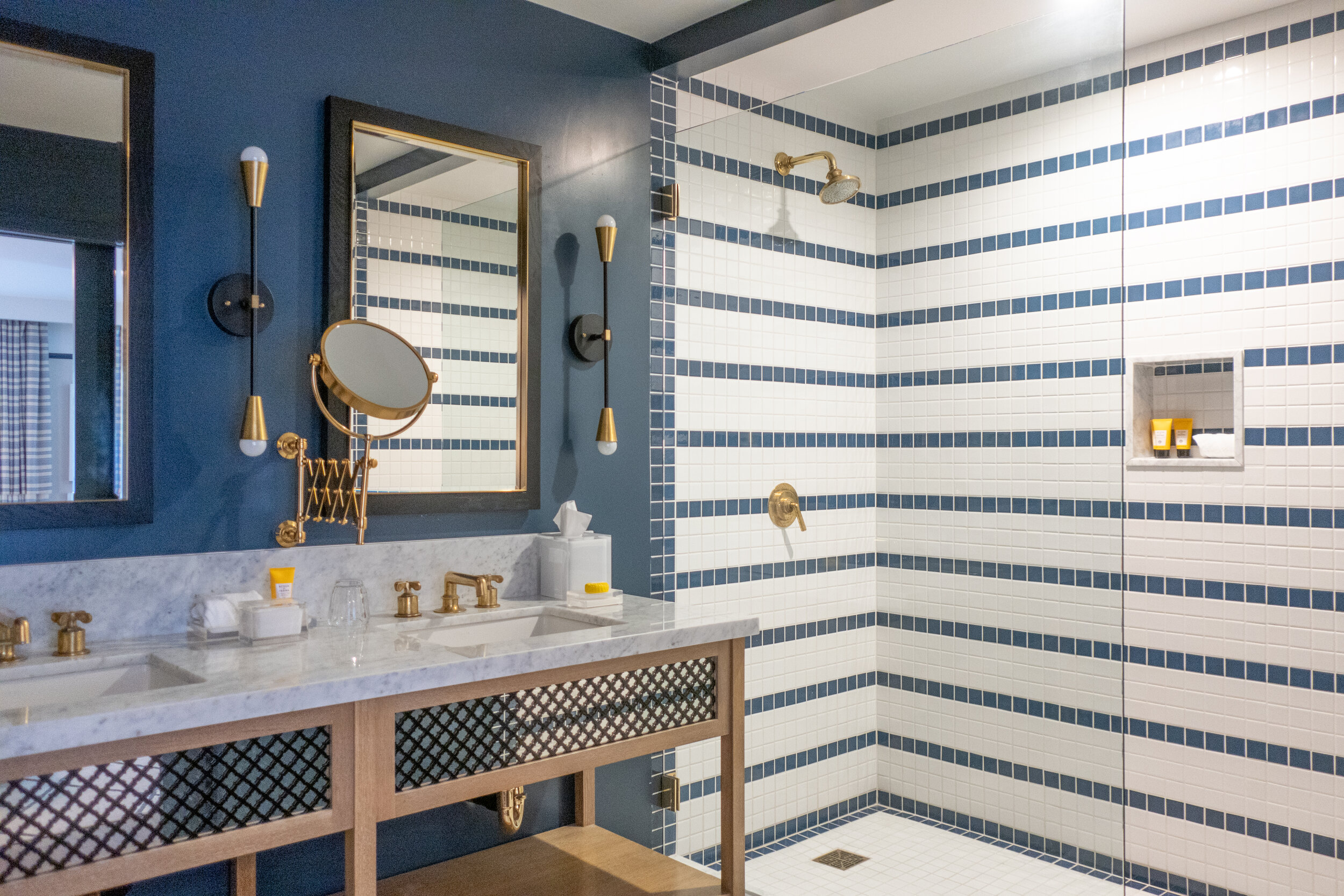   The bathroom has his-and-hers sinks and is stocked with Acqua di Parma amenities  