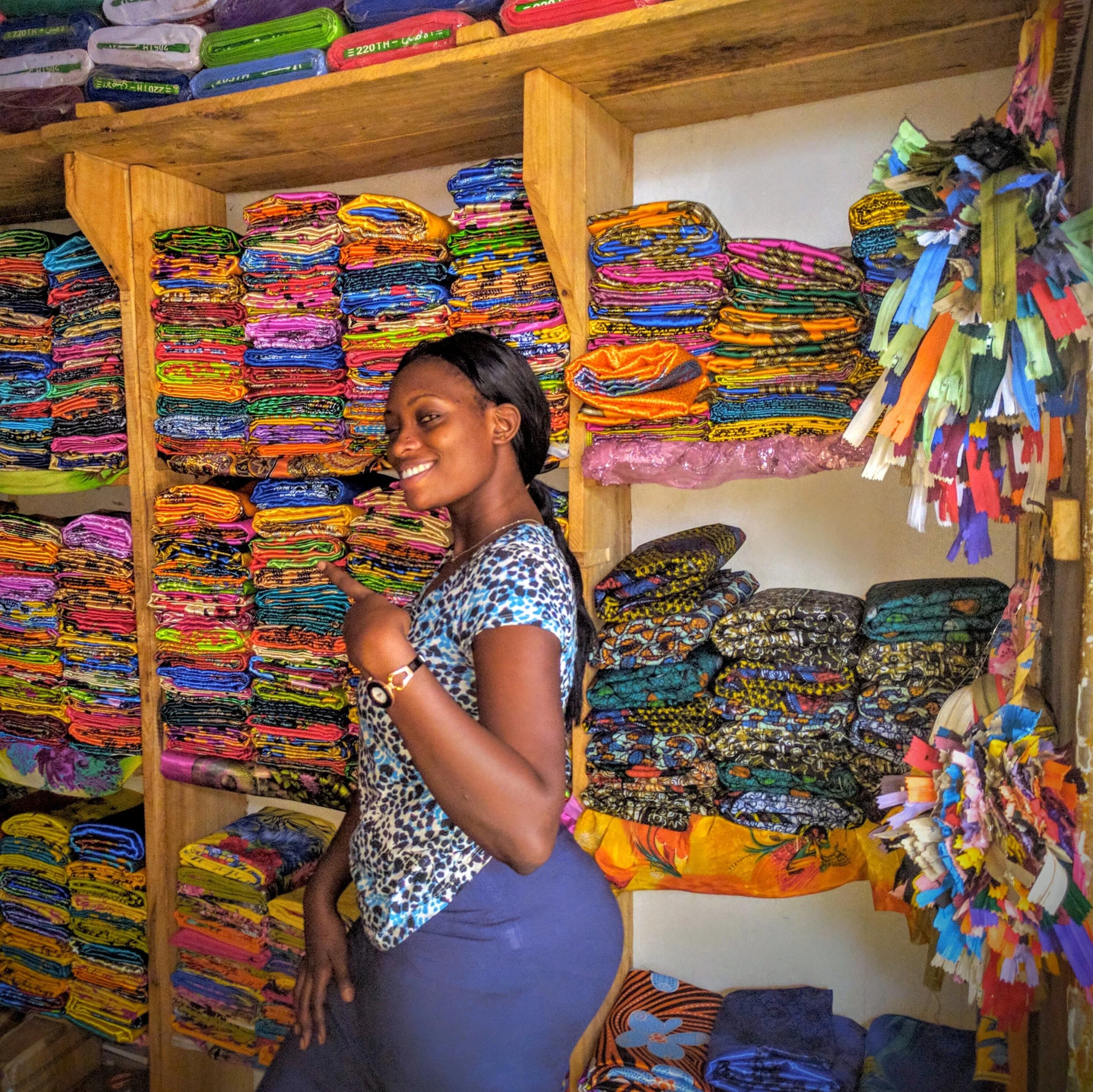 Purchasing fabric with Helen for my Gomesi dress – traditional Ugandan cultural dress