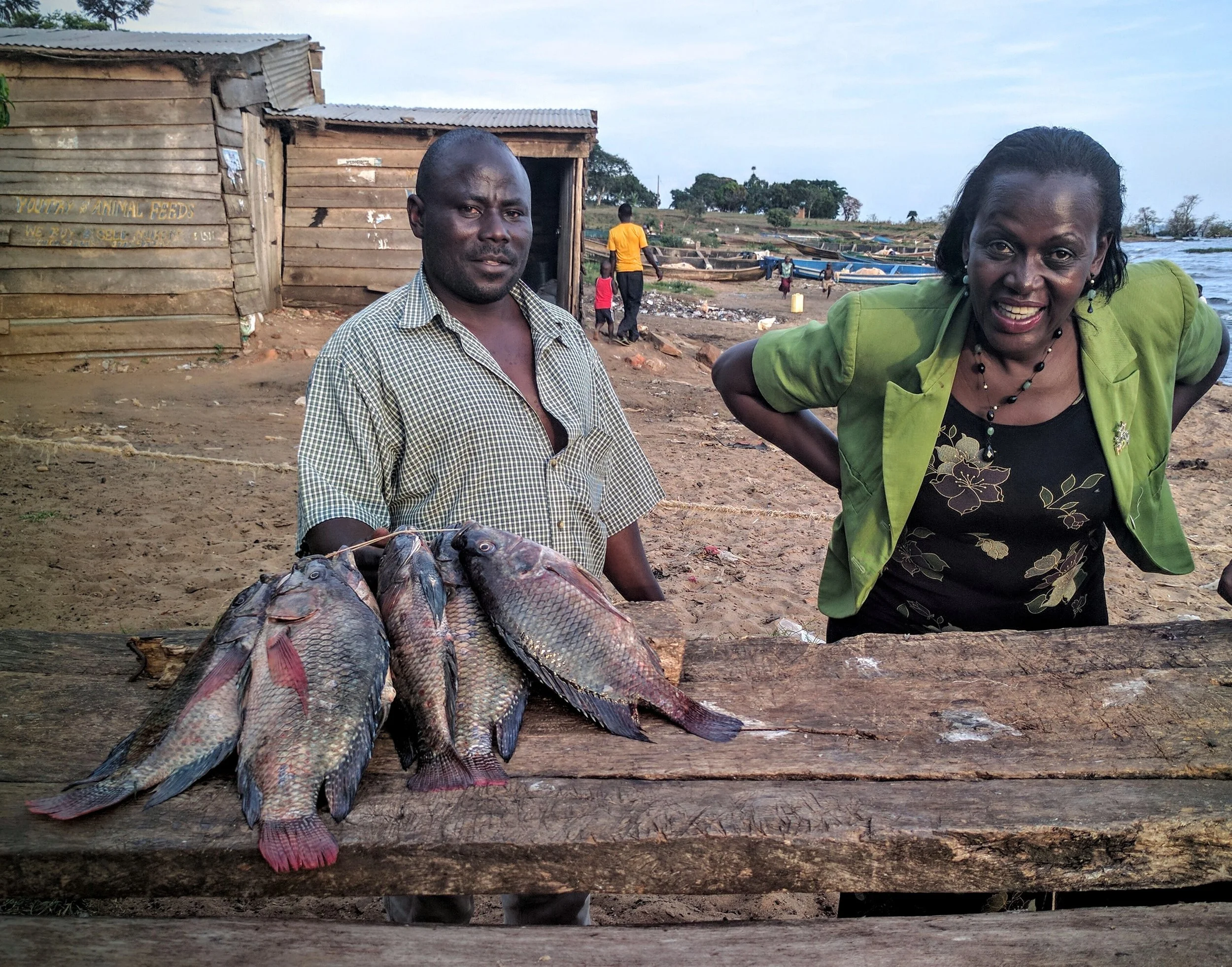 Picking up fresh tilapia at a small fishing village on the lake