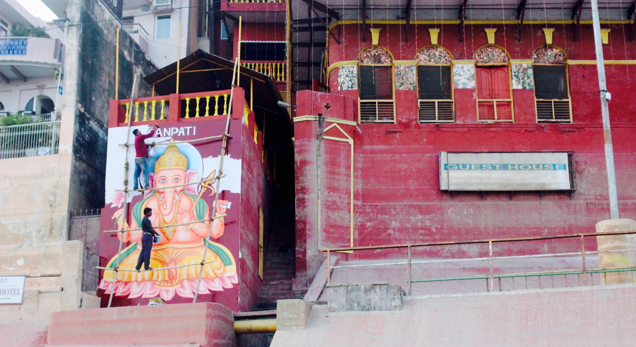Images of Ganesha everywhere, the Hindi God worshipped on Diwali. They started painting that mural only yesterday.