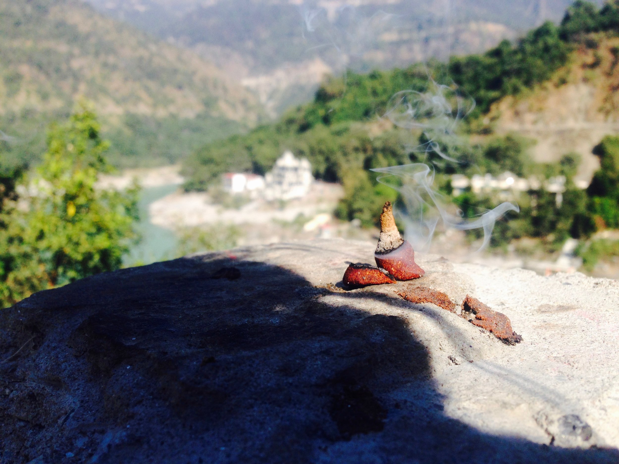 Sandalwood dhoop burning on the rocks
