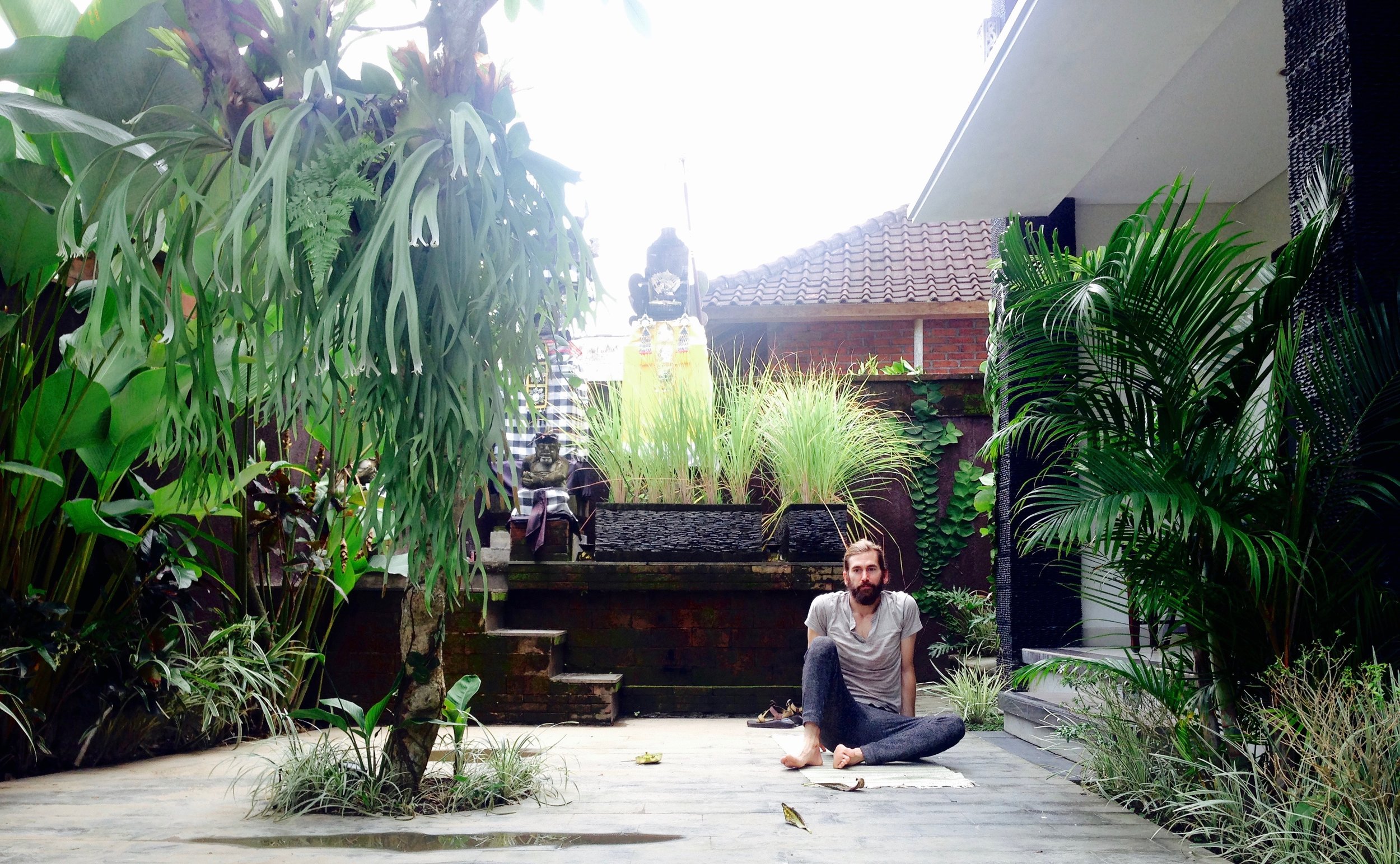 Doing yoga poolside at the fancy spot next to our hostel. Post savasana face.