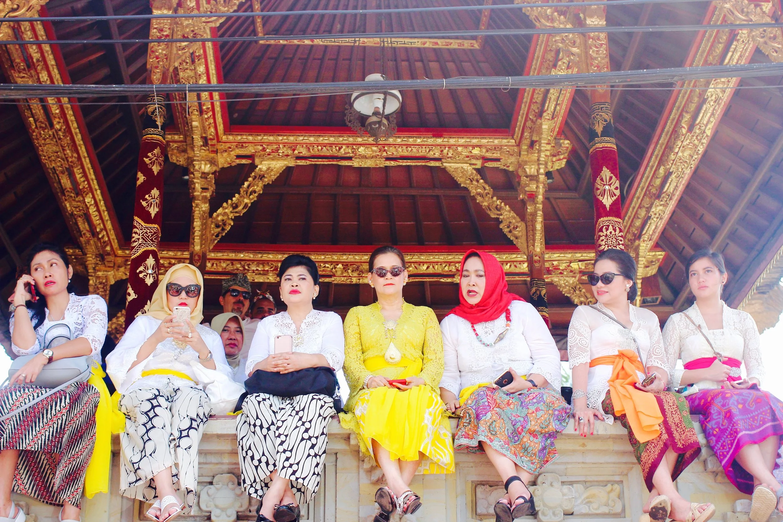 Waiting in the scorching heat before the ceremony begins. Women are dressed to the nines!