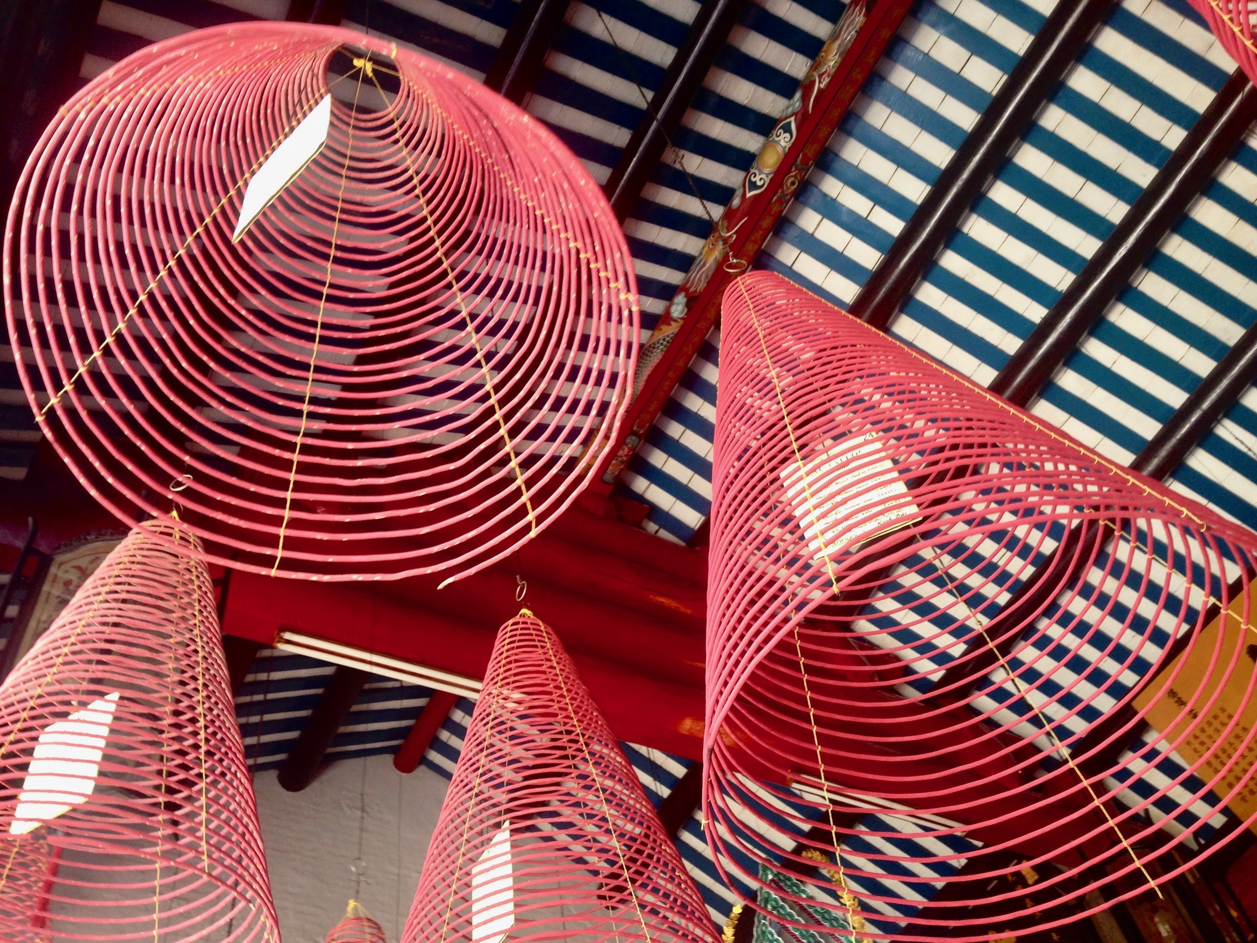 Incense hanging from the ceiling of a historical Chinese Assembly Hall. Kinda looks like the conical hats Vietnamese locals wear, no? See photo above.