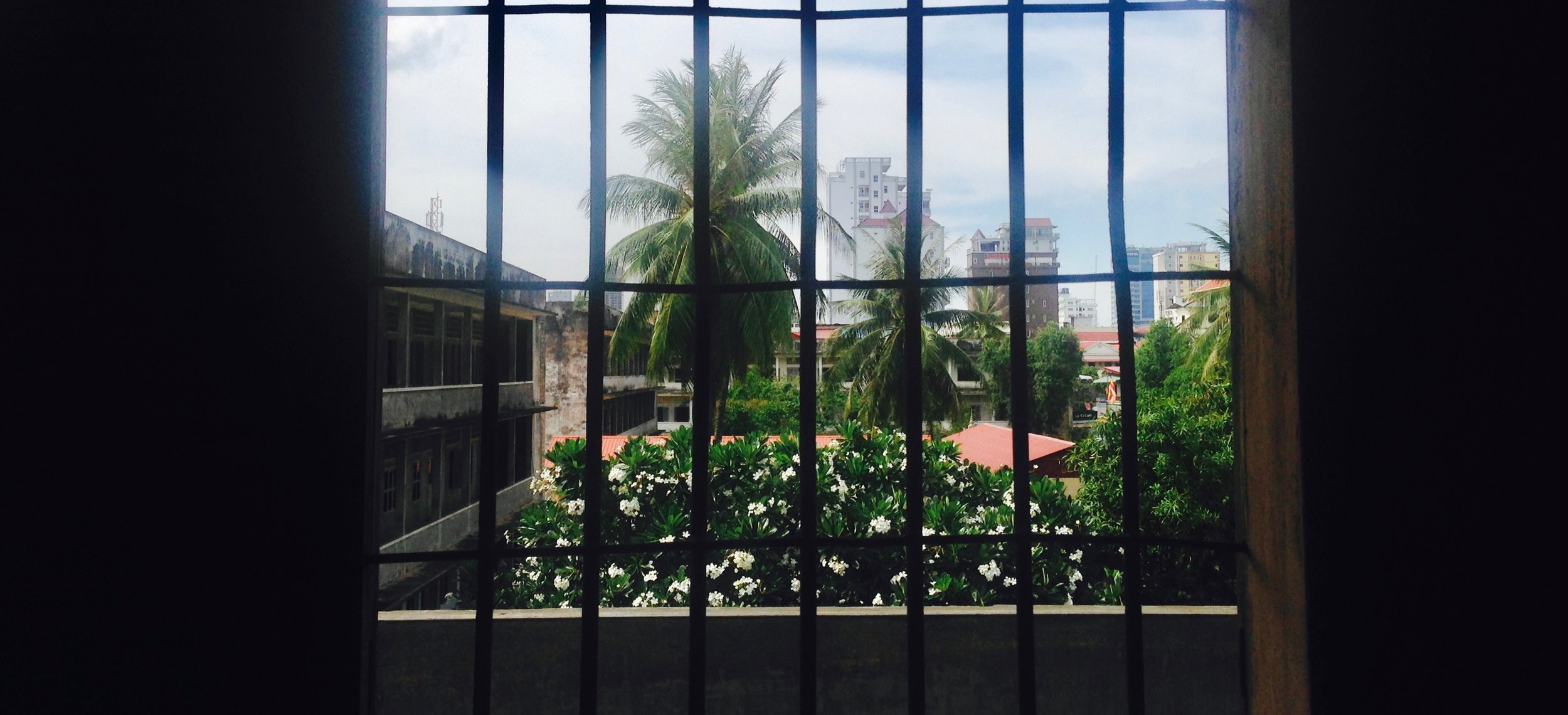 Looking out onto the courtyard from behind bars 