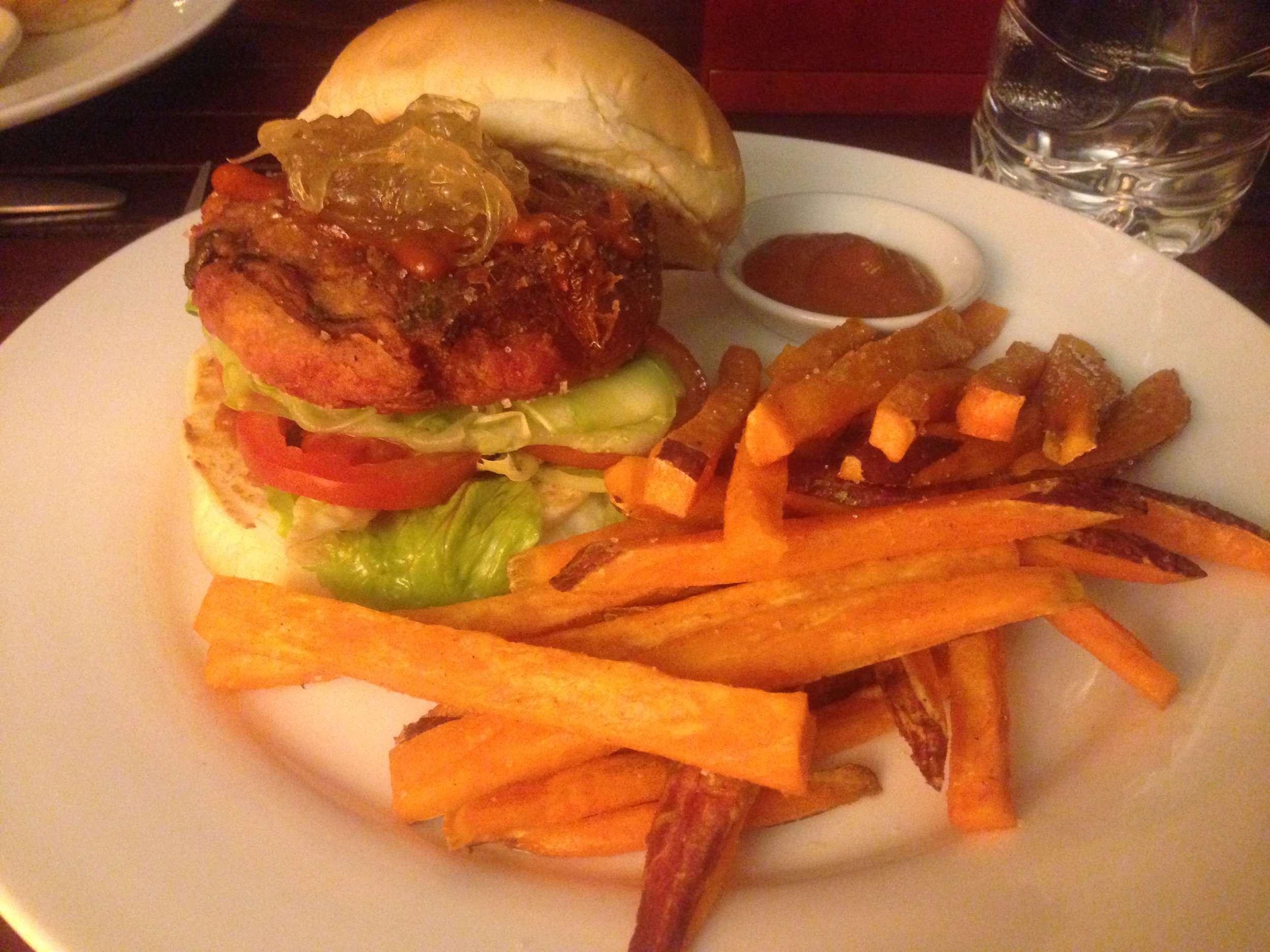 Beet root veggie burger with sweet potato fries 