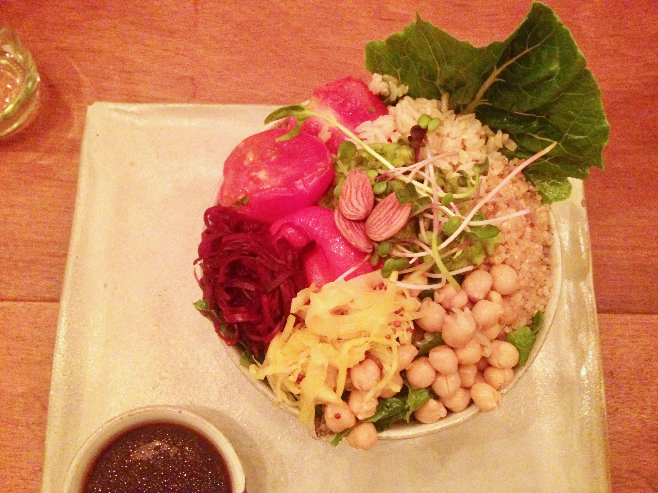 Chickpea, sauerkraut and cashew salad on a bed of lettuce and quinoa 