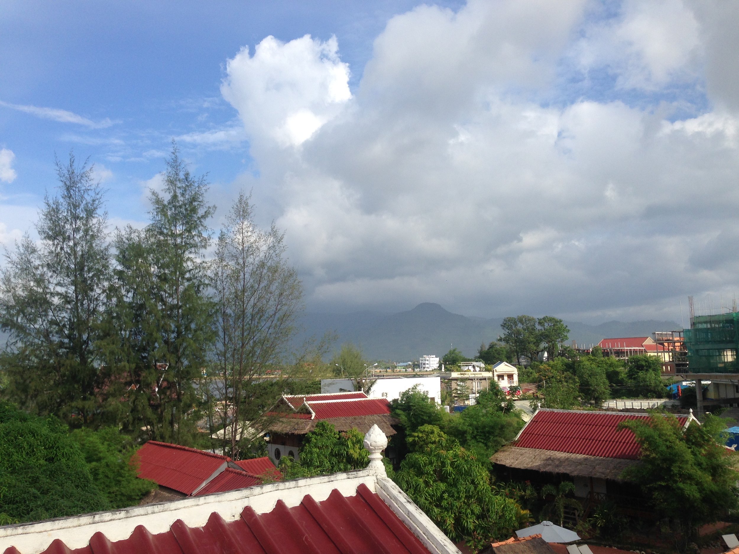 Rooftop vibes, looking at the misty Bokor Mountain