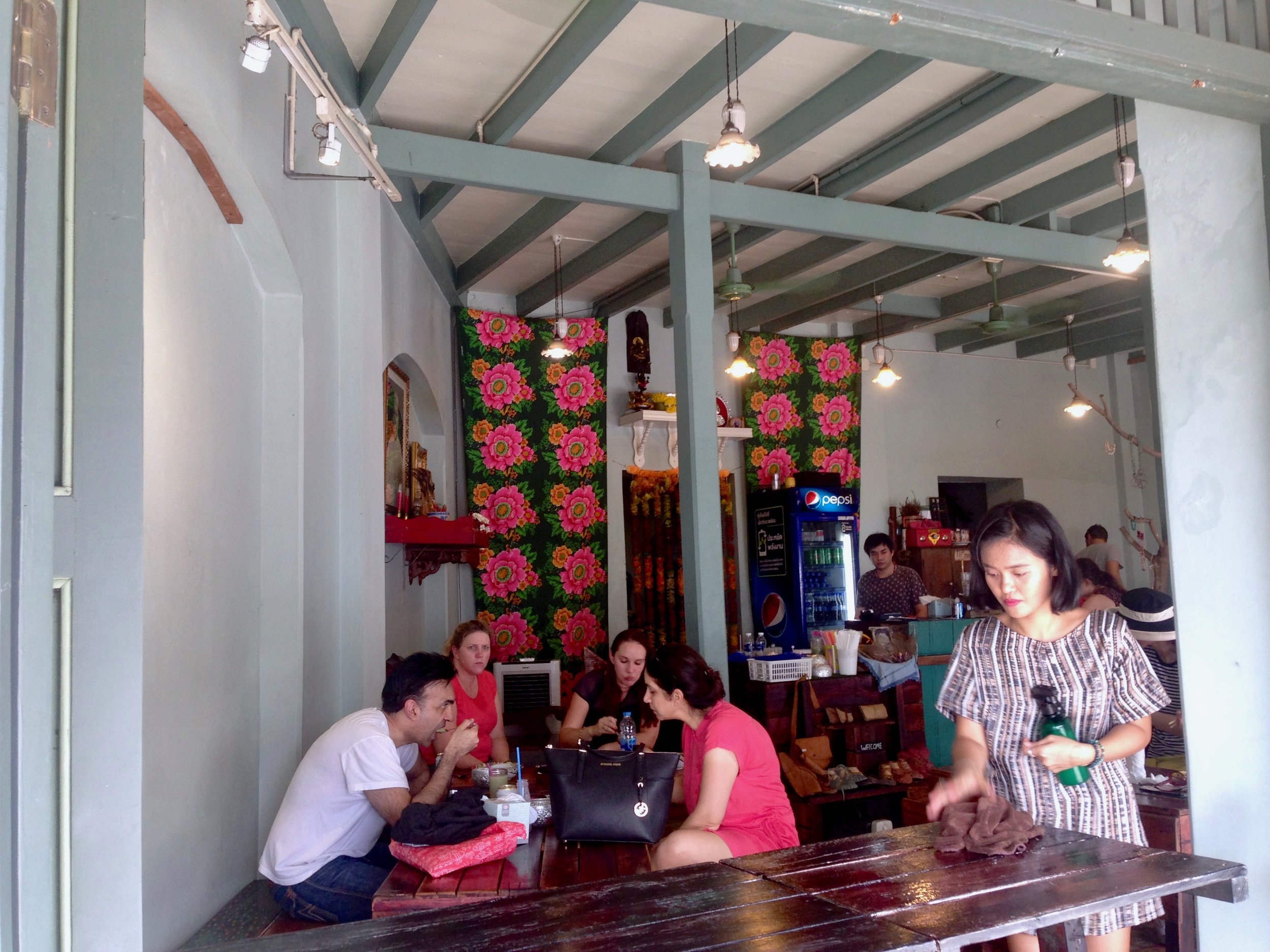 While waiting for Wylie to check out the reclining Buddha, I sipped on some coconut and hung out with a furry friend in this cute little joint 