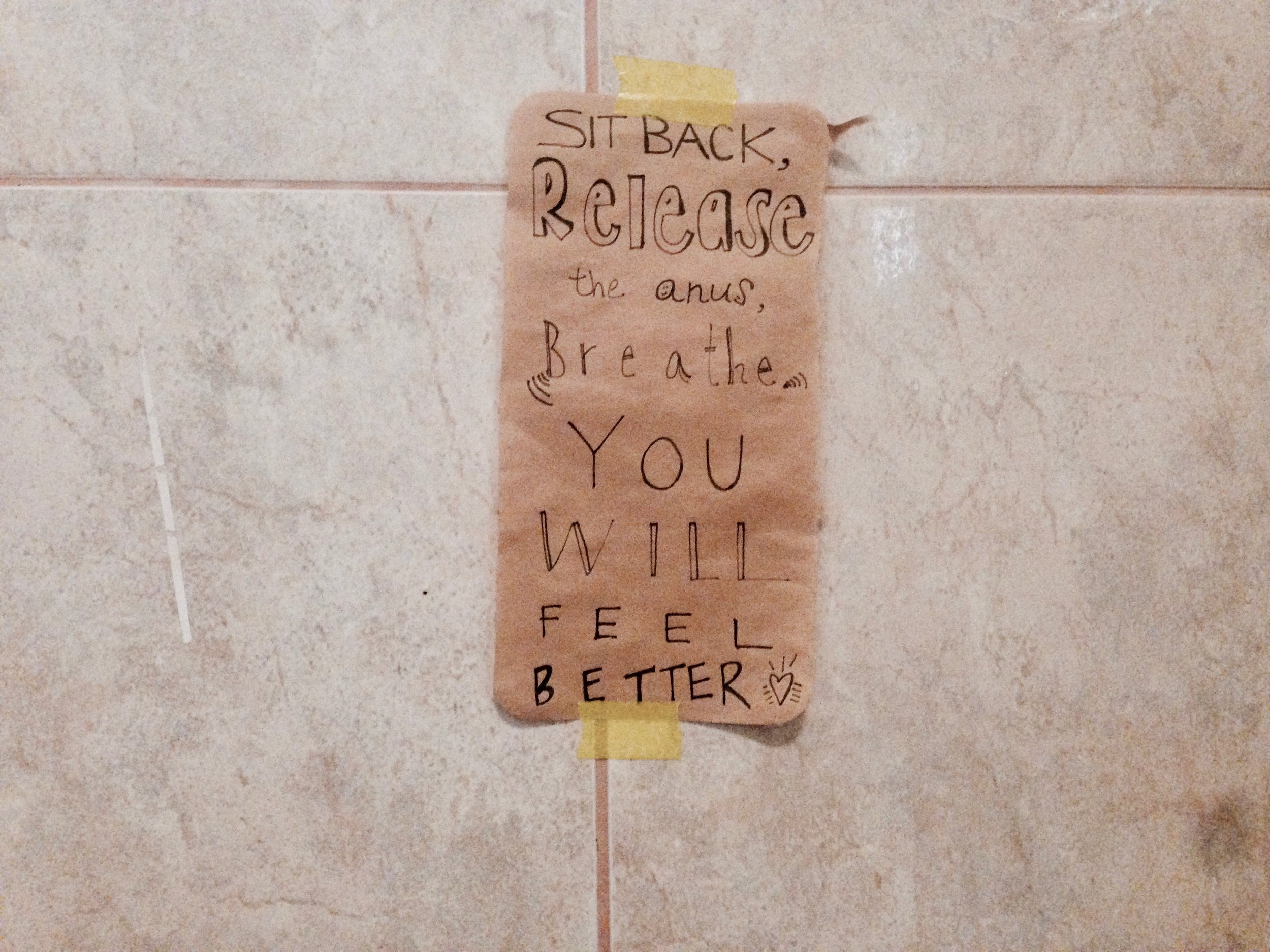 Word play off of "squeeze your anus," an ashtanga phrase referring to the "moola banda lock" to help create internal heat for the practice. Love me a good motivational colema sign.