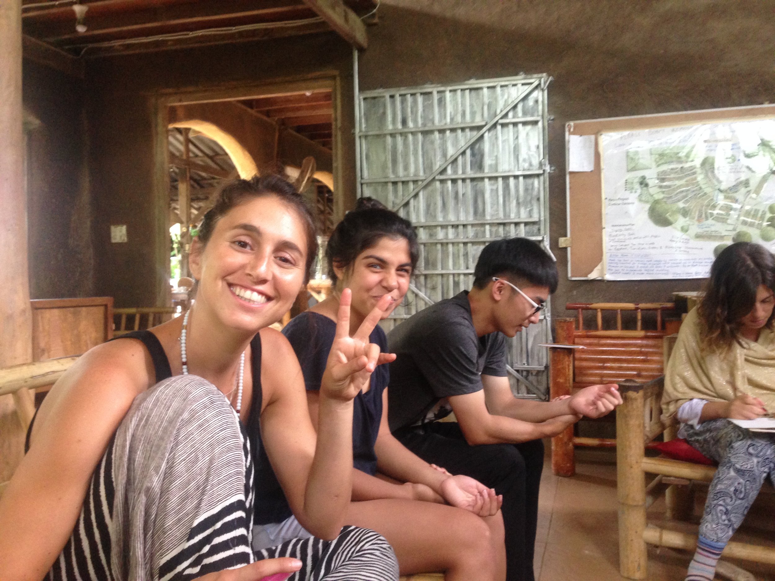 My home slice Martha (from Peru) throwing up peace signs as we get ready for an Ayurvedic workshop in the sala