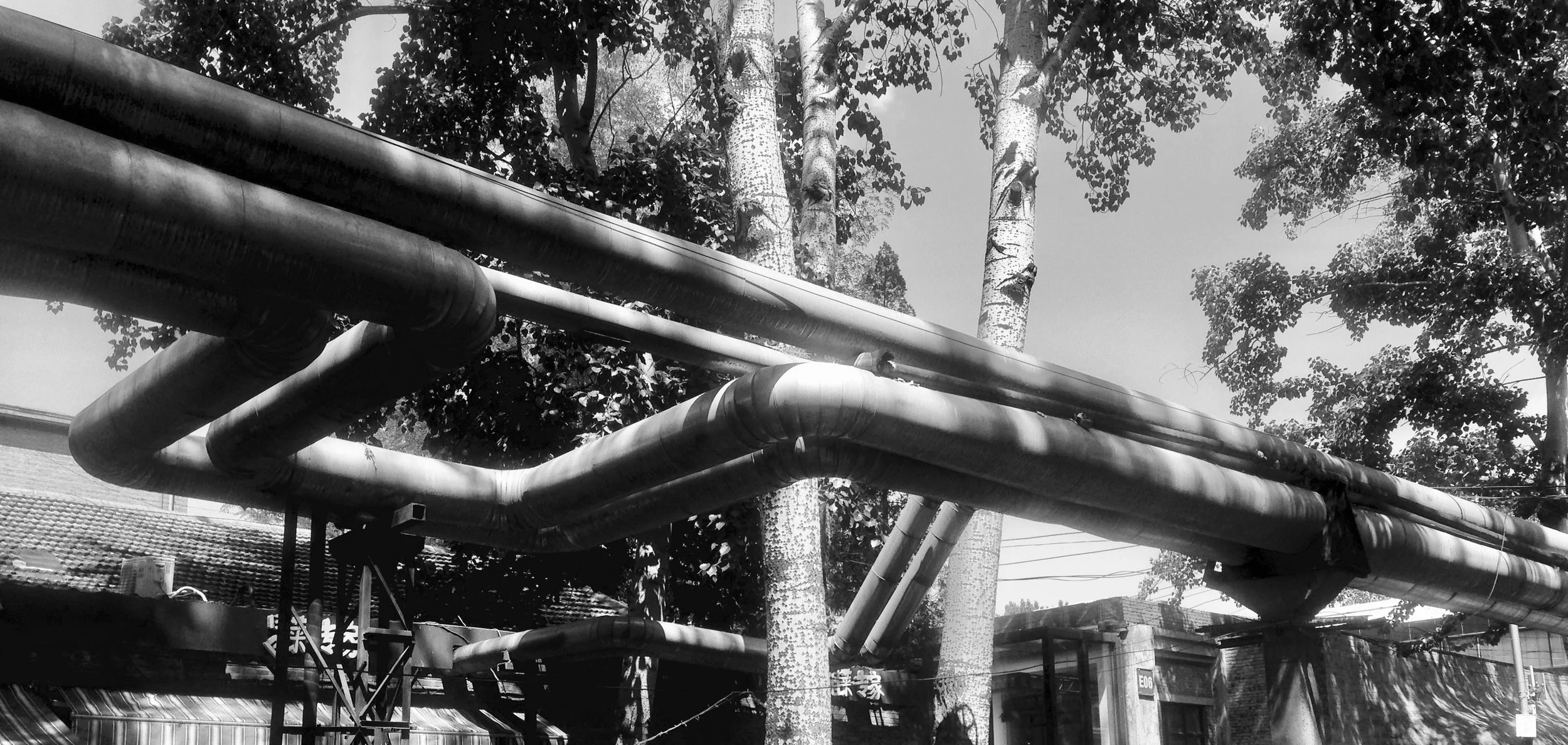 Exposed piping runs all around this little complex, harkening back to the good ole day of Mao