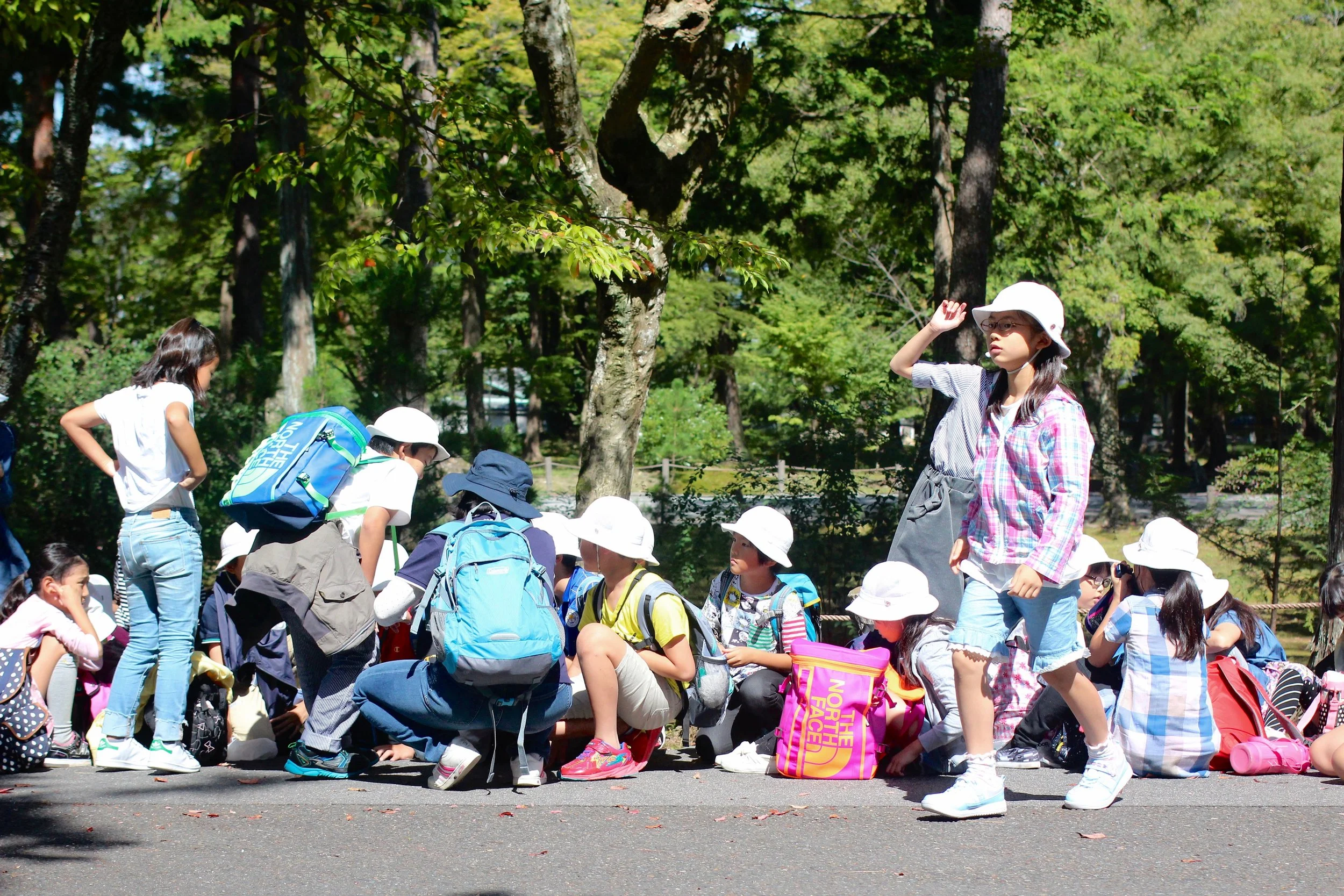Japanese schoolkids in their matching fishermen hat