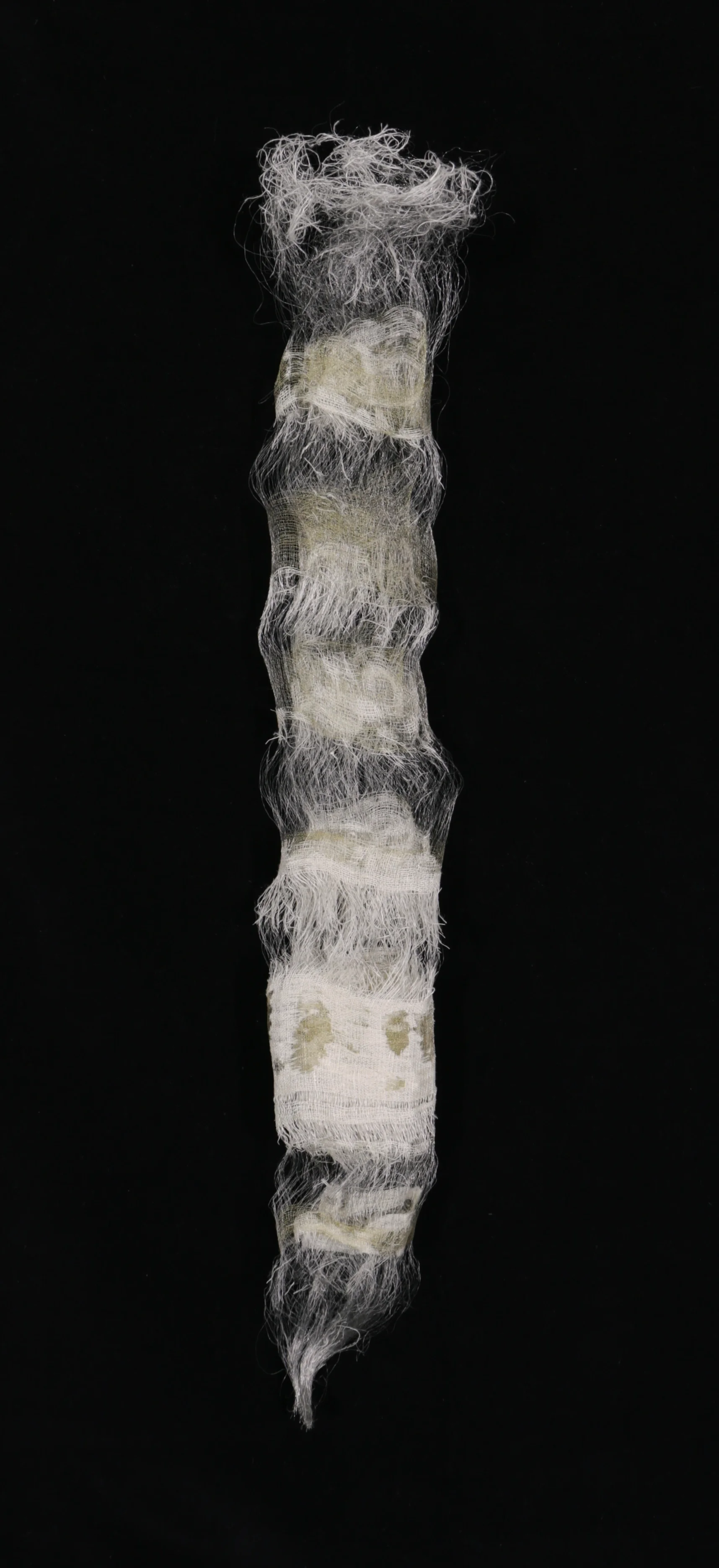 "Instar". Linen, cotton, brass, stainless steel. 23" x 6" x 2.5". 2017.
