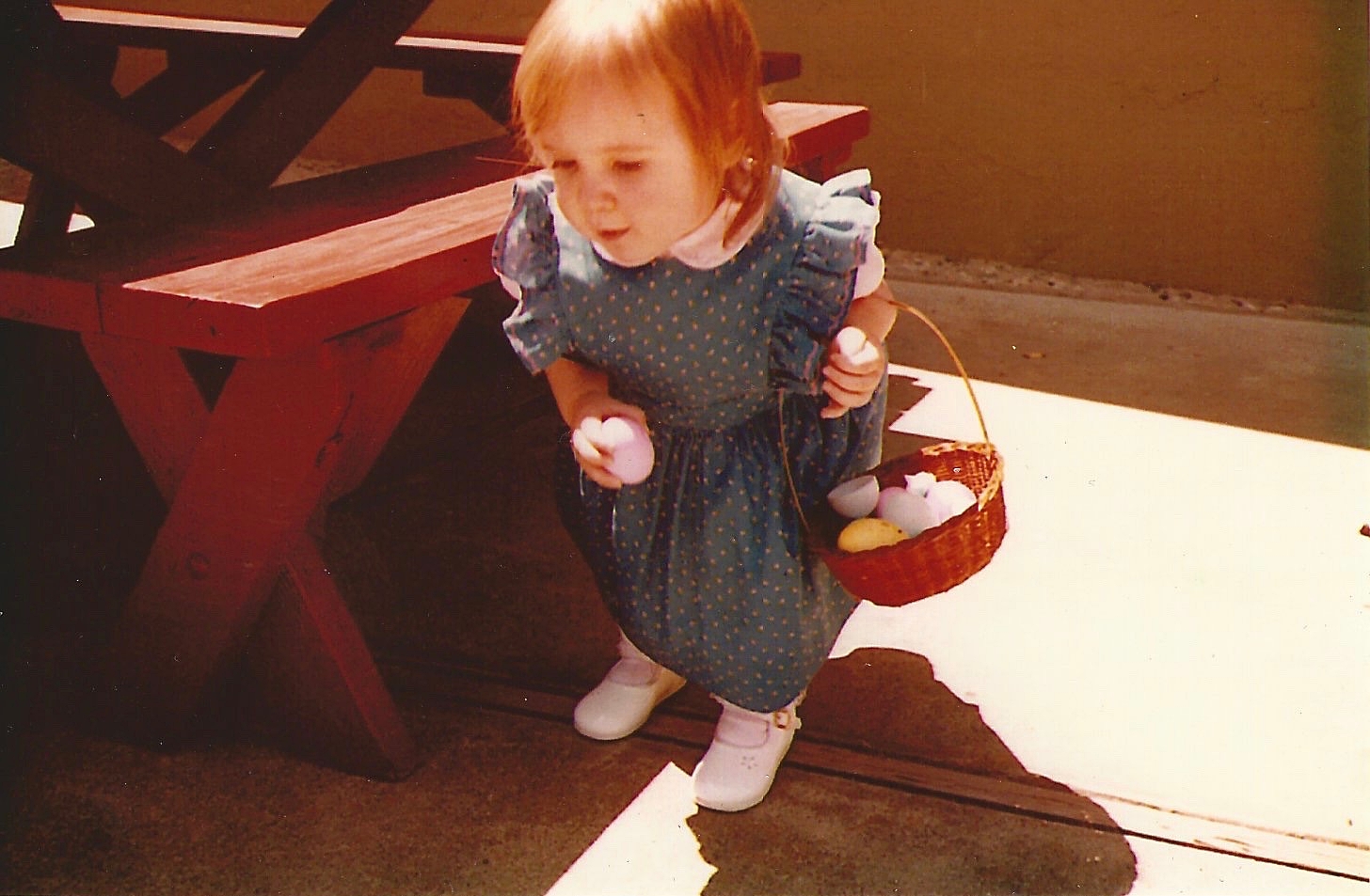 Kate at 18-months-old, on the hunt for Easter eggs.