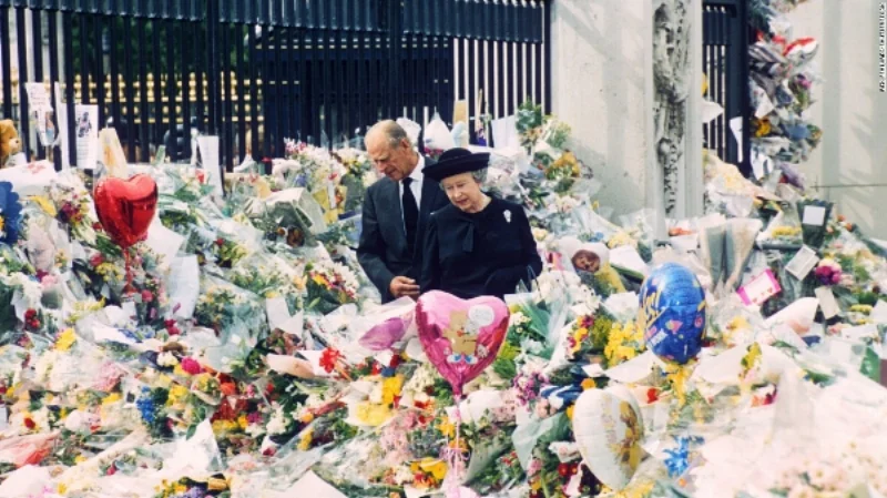 Queen Elizabeth and Prince Philip survey the tributes to Diana.