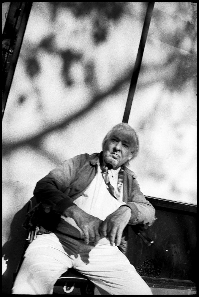 #0435_34A - Man In Wheelchair, Mid-Market Street. San Francisco, CA. March 2016. Leica M2, Zeiss 35mm f/2, Ilford HP5 400.